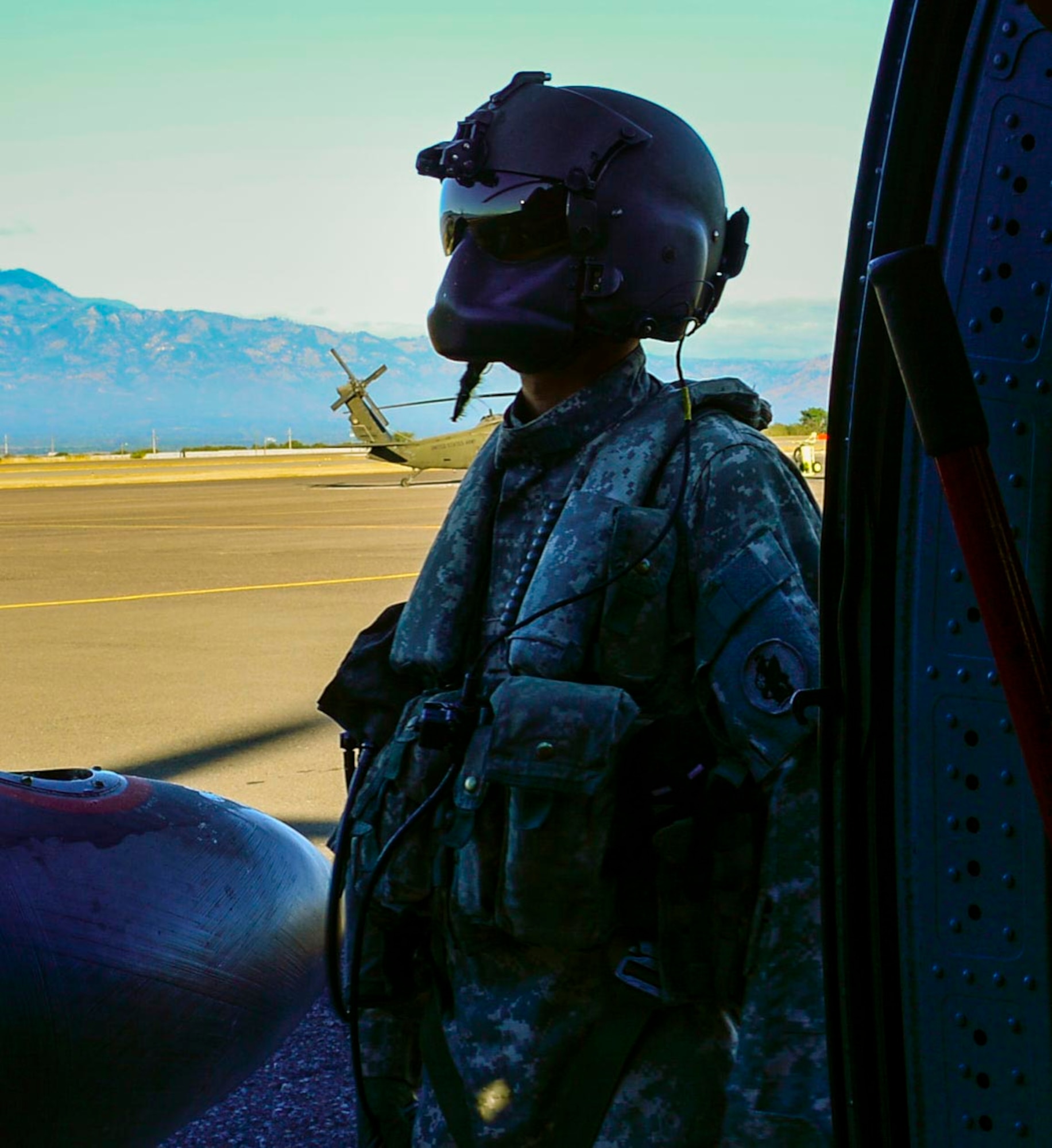 A U.S. Army crew chief assigned to the 1st Battalion, 228th Aviation Regiment starts pre-flight checks on a UH-60 Blackhawk helicopter for deck landing qualifications at Soto Cano Air Base, Honduras, Feb. 1, 2015.  The 1-228th Avn. Reg. aircrew participated in deck landing qualifications on board the USS Kauffman to qualify pilots and crew chiefs on shipboard operations.   Kauffman is on its final scheduled deployment to the U.S. Southern Command area of responsibility supporting multinational, counter-narcotics operation known as Operation Martillo. (U.S. Air Force photo/Tech. Sgt. Heather Redman)