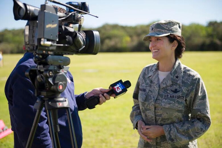 Brig. Gen. Nina Armagno, 45th Space Wing commander, is interviewed by News 13 Brevard County Reporter Greg Pallone about the unveiling of the Weather-Bot. The Weather-Bot is a robot used to help members of the 45th Weather Squadron release weather balloons without risking human life when lightning is too close. (U.S. Air Force Photo/Matthew Jurgens)