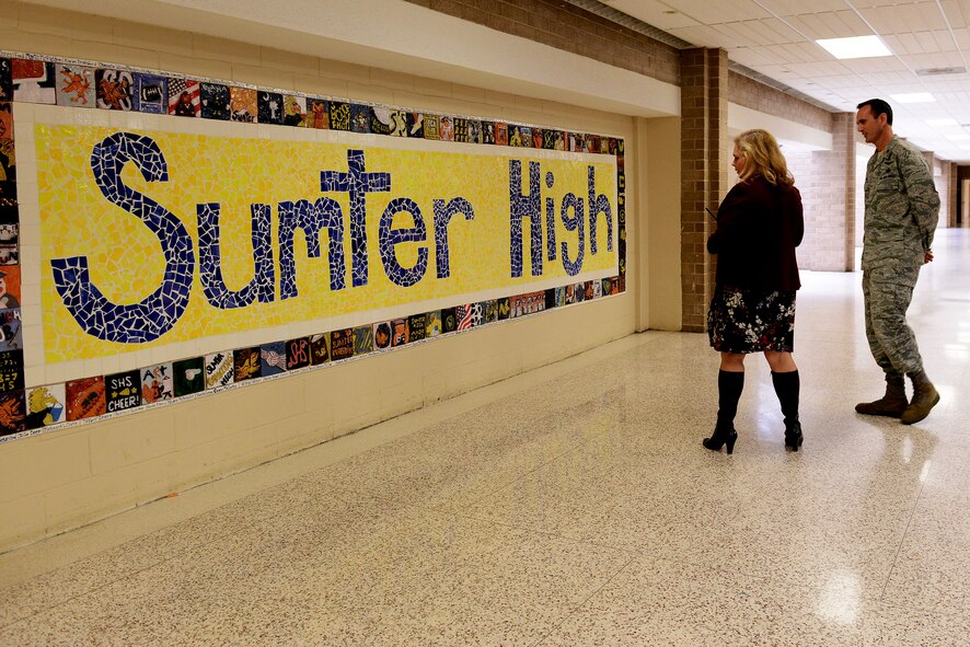 U.S. Air Force Lt. Col. Joseph Rodriguez, 20th Mission Support Group deputy commander, is given a tour by Marie Mulholland, Sumter High School international baccalaureate coordinator, at Sumter High School, Sumter, S.C., Feb. 2, 2015. Rodriguez, a Sumter school district board member and Shaw Air Force Base representative, was invited to visit the school for School Board Recognition Month. (U.S. Air Force photo by Airman 1st Class Diana M. Cossaboom/Released)