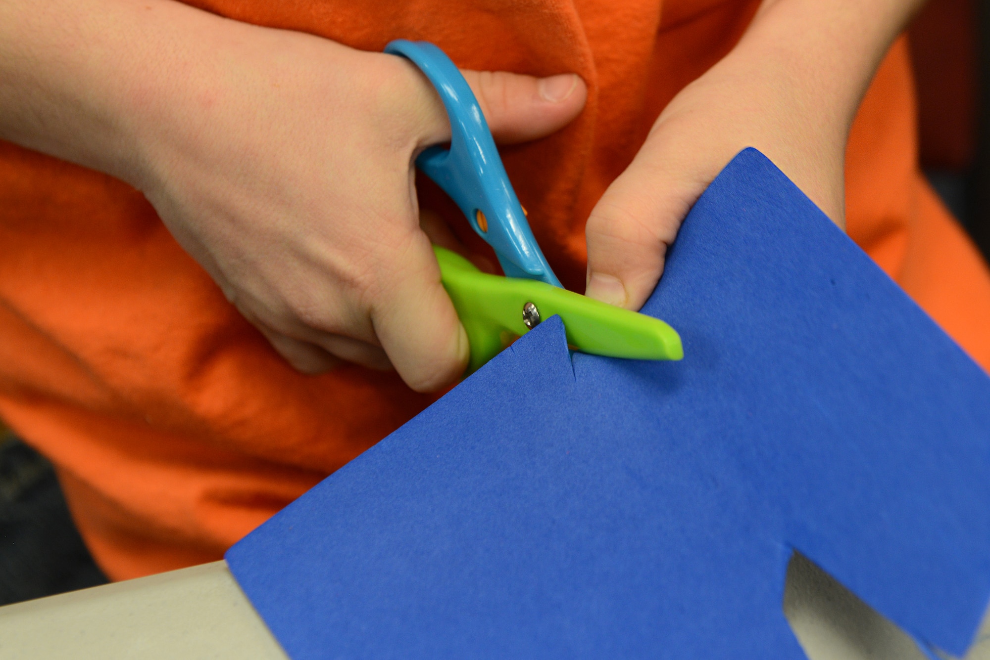 Kyler Brown, son of deployed U.S. Air Force Tech. Sgt. Jonathan Brown, 23d Civil Engineering Squadron heavy equipment operator, makes a card during the Deployed and Remote Family Dinner Jan. 29, 2015, at Moody Air Force Base, Ga. All the children at the event made arts and crafts to send to their deployed parent. (U.S. Air Force photo by Airman 1st Class Kathleen D. Bryant/Released)