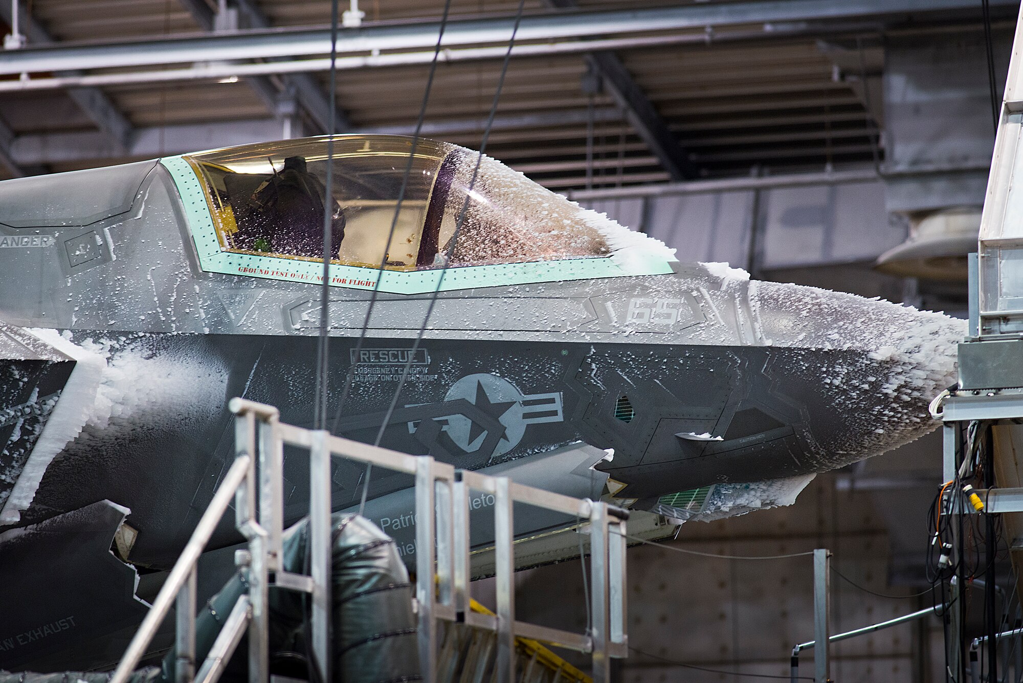 An F-35 endures freezing temperatures in the 96th Test Wing's McKinley Climatic Laboratory at Eglin Air Force Base, Fla., Jan. 27.  The joint strike fighter has undergone four months of climate testing in the lab to certify the fleet to deploy to any corner of the world.  (U.S. Air Force photo/Samuel King Jr.)