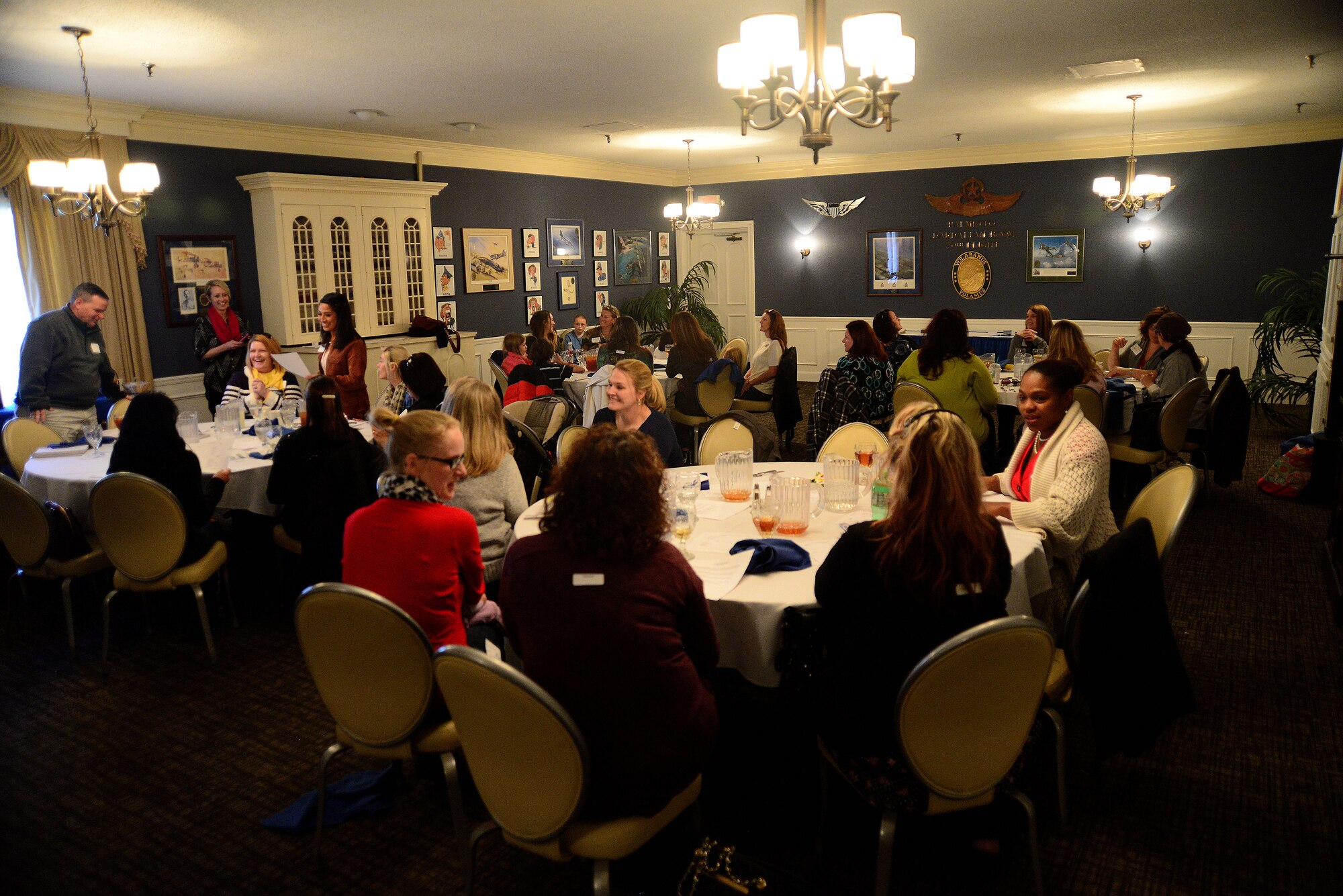Key spouses and mentors attend a key spouses’ round table at Shaw Air Force Base, S.C., Jan. 28, 2015. During the round table, spouses split into four groups and role-played possible scenarios that could be encountered while trying to assist another spouse. (U.S. Air Force photo by Airman 1st Class Michael Cossaboom/Released)