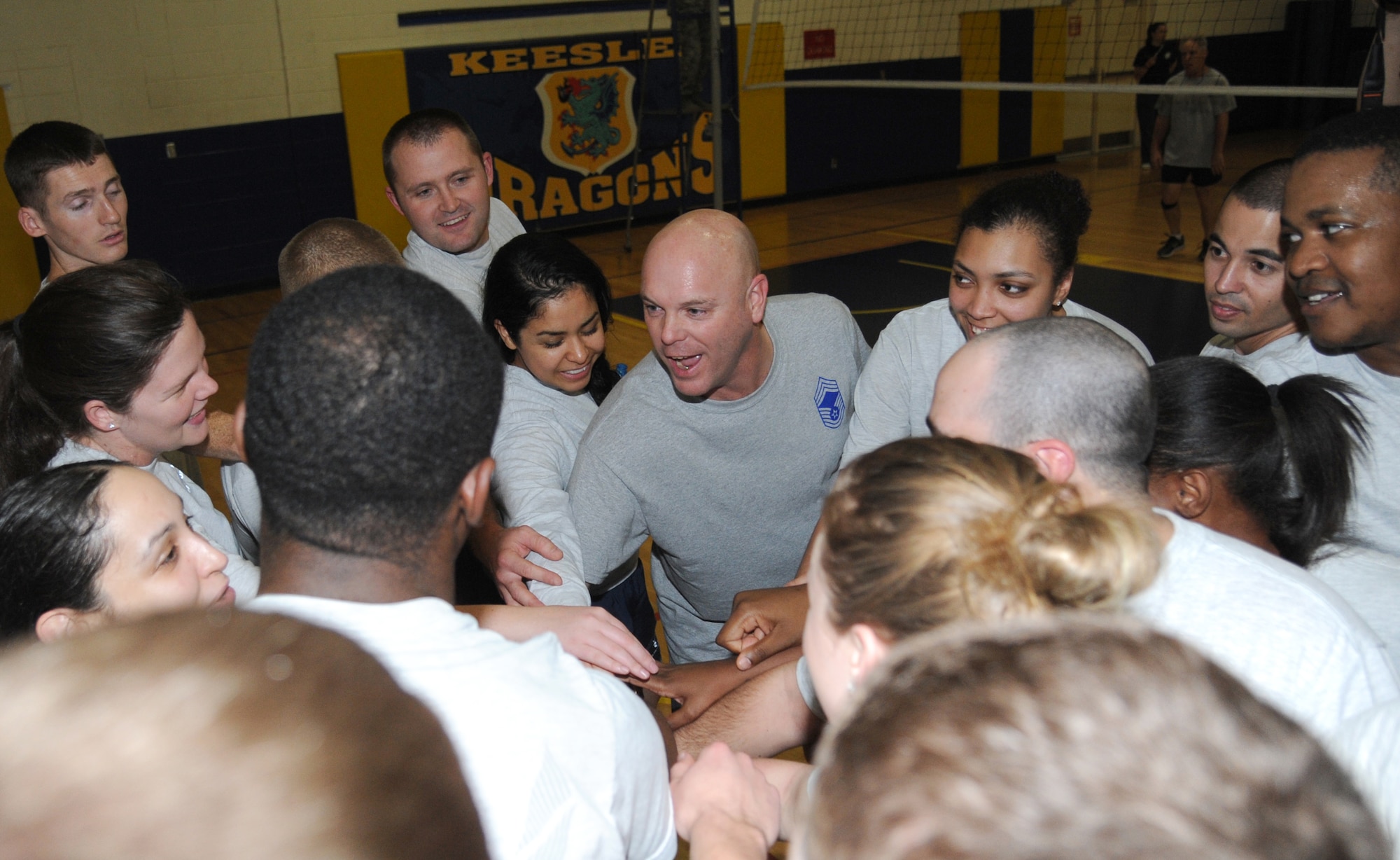Chief Master Sgt. David Staton, 2nd Air Force command chief, gives Airman Leadership School students a pep talk during the volleyball match between the Chiefs Group and Airmen Leadership School students Jan. 29, 2015, at the Blake Fitness Center, Keesler Air Force Base, Miss.  The friendly game is played during every ALS class which teaches students teamwork and mentorship.   The chiefs defeated ALS, beating them two games to one.  (U.S. Air Force photo by Kemberly Groue)