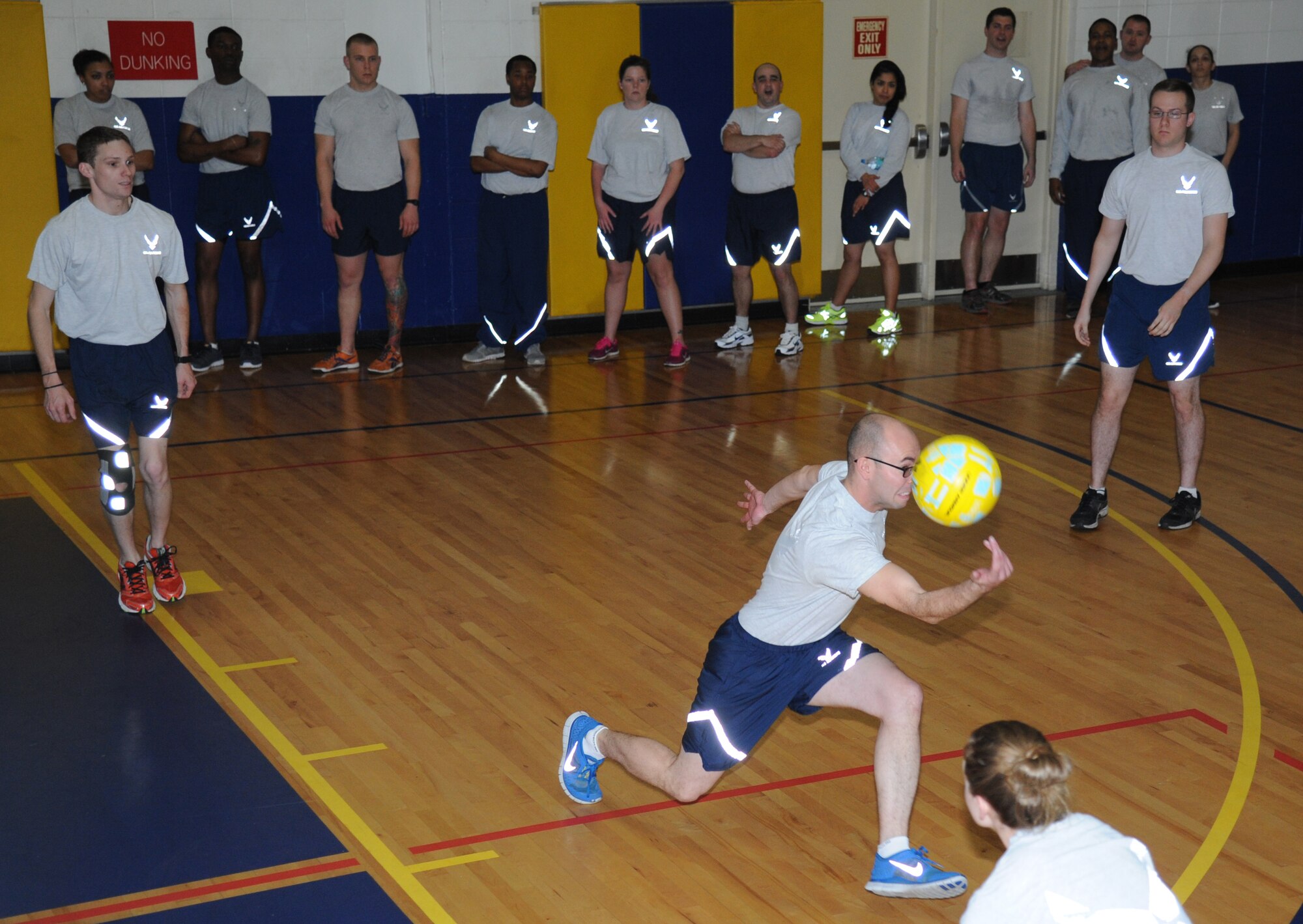 Senior Airman Paul Wampole, 85th Engineering Installation Squadron cable and antenna maintainer and Airman Leadership School student, hustles to save the ball during a volleyball match between the Chiefs Group and ALS students Jan. 29, 2015, at the Blake Fitness Center, Keesler Air Force Base, Miss.  The friendly game is played during every ALS class which teaches students teamwork and mentorship.  The Chiefs Group defeated the ALS after winning two out of three matches.  (U.S. Air Force photo by Kemberly Groue)