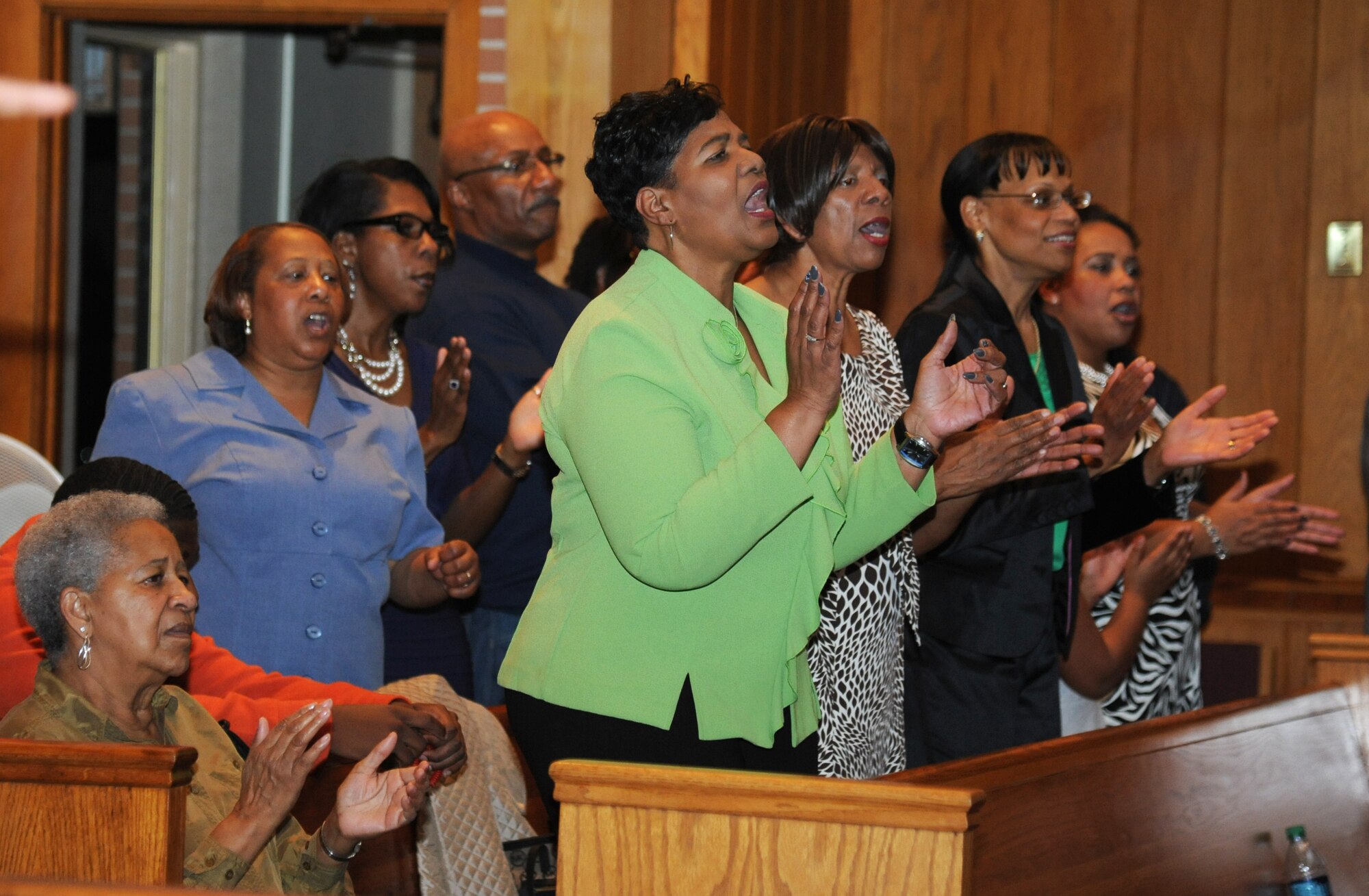 Attendees sing along with a choir performance during the Gospel Concert Jan. 31, 2015, at the Triangle Chapel, Keesler Air Force Base, Miss.    The African American Heritage Committee hosted the praise and worship service to celebrate Black History Month. (U.S. Air Force photo by Kemberly Groue)