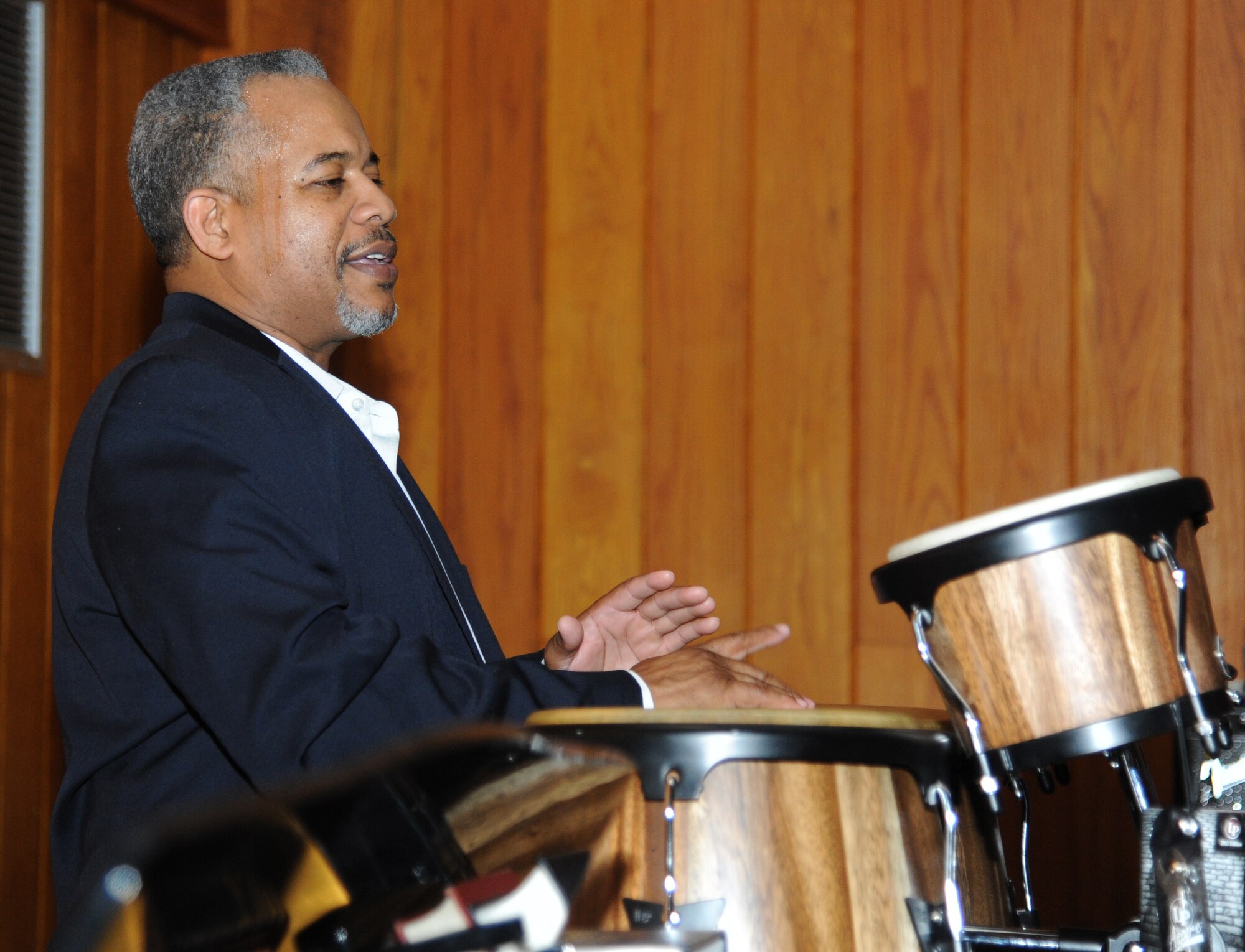 Retired Chief Master Sgt. Curtis Jennings plays bongos for the Keesler  Gospel Choir during the 2015 Gospel Concert Jan. 31, 2015, at the Triangle Chapel, Keesler Air Force Base, Miss.   The African American Heritage Committee hosted the praise and worship service to celebrate Black History Month. (U.S. Air Force photo by Kemberly Groue)