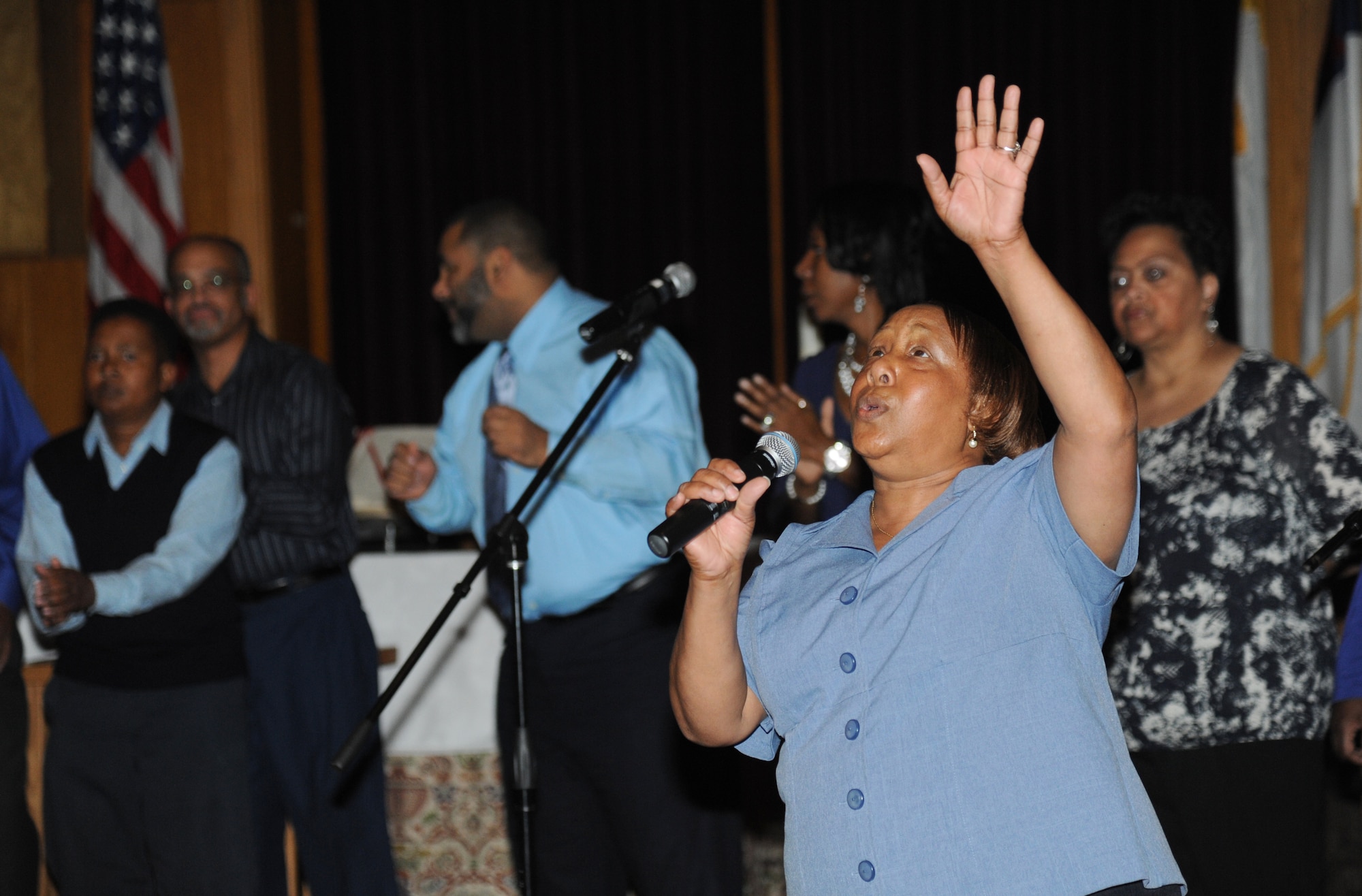 Sabrena Davis, Keesler Gospel Choir member, leads the choir during the 2015 Gospel Concert Jan. 31, 2015, at the Triangle Chapel, Keesler Air Force Base, Miss.  The African American Heritage Committee hosted the praise and worship service to celebrate Black History Month. (U.S. Air Force photo by Kemberly Groue)