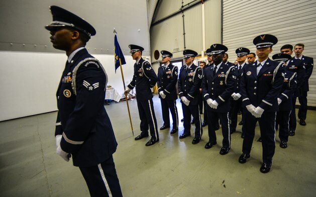 Honor guardsmen stand at parade rest during an honor guard graduation ceremony at Ramstein Air Base, Germany, Jan. 30, 2015. The Ramstein honor guard practices weekly to ensure they keep movements and procedures sharp for official ceremonies. (U.S. Air Force photo/Senior Airman Nicole Sikorski)