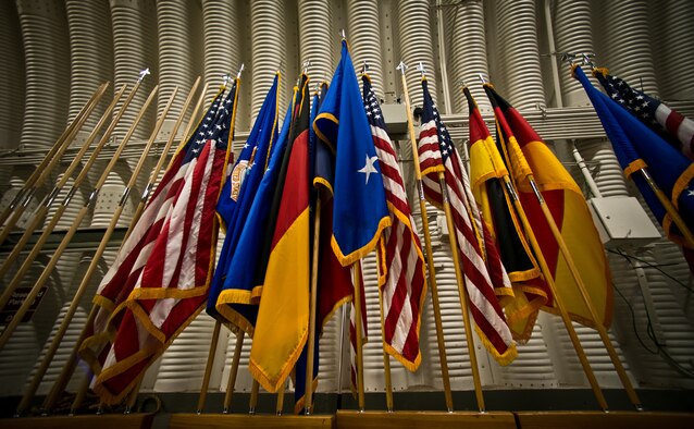 Flags stand in the base honor guard hangar at Ramstein Air Base, Germany, Jan. 21, 2015. The vision of the Honor Guard is to ensure a legacy of Airmen who promote the mission, protect standards, perfect the image and preserve heritage. (U.S. Air Force photo/Senior Airman Nicole Sikorski)