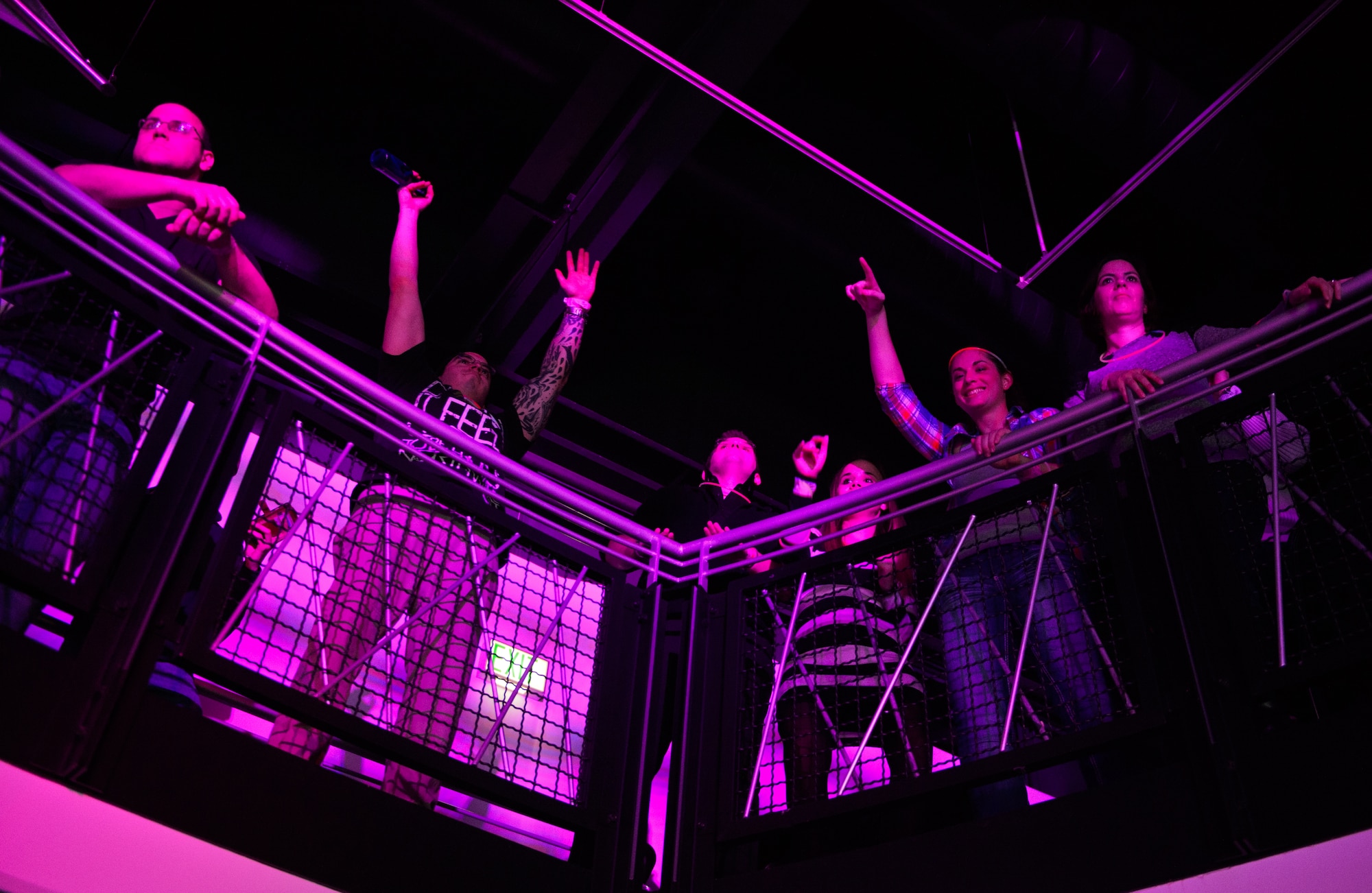 Members of the Kaiserslautern Military Community dance to a song played by the Electronic Dance Music USO tour at Ramstein Air Base, Germany, Jan. 31, 2015. The USO hosted four disc jockeys to play for the troops around Europe. (U.S. Air Force photo/Senior Airman Armando A. Schwier-Morales)