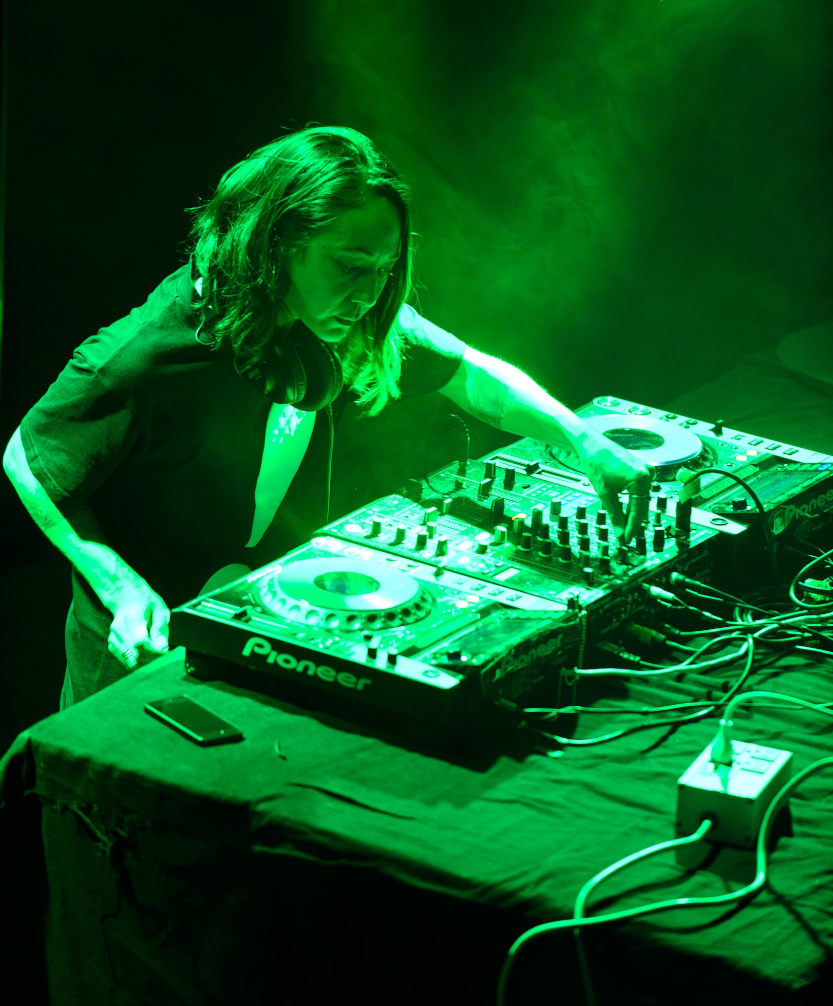 Disc Jockey Ana Sia performs for Airmen, Soldiers and civilians at Ramstein Air Base, Germany, during an Electronic Dance Music tour Jan. 31, 2015. Ana Sia and three other DJs participated in the USOs first overseas EDM. (U.S. Air Force photo/Senior Airman Armando A. Schwier-Morales)