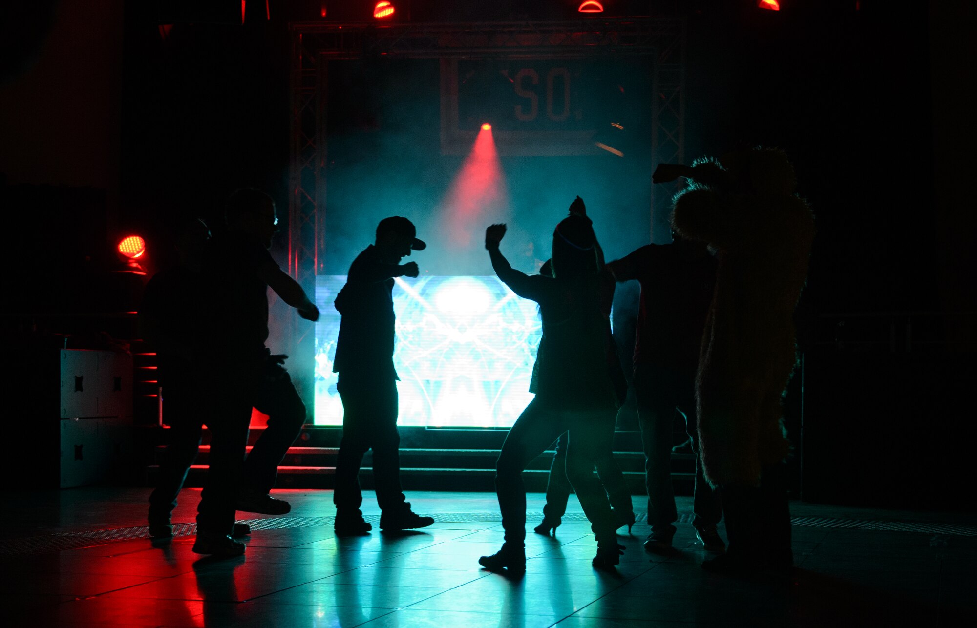 Kaiserslautern Military Community members dance to Electronic Dance Music at Ramstein Air Base, Germany. The USO and 86th Force Support Squadron hosted Disc Jockeys Kraddy, Ana Sia, SuperVision and Paul Basic as part of an EDM tour. (U.S. Air Force photo/Senior Airman Armando A. Schwier-Morales)