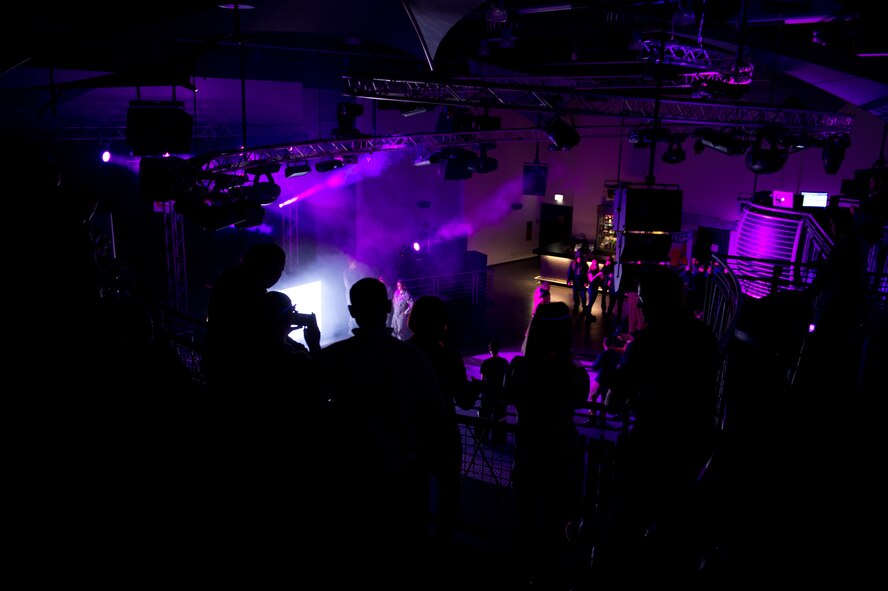 Members of the Kaiserslautern Military Community watch disc jockeys perform for the troops at Ramstein Air Base, Germany, Jan. 31, 2015. Four DJs played for the troops during the USOs Electronic Dance Music tour that started at Ramstein. (U.S. Air Force photo/Senior Airman Armando A. Schwier-Morales)