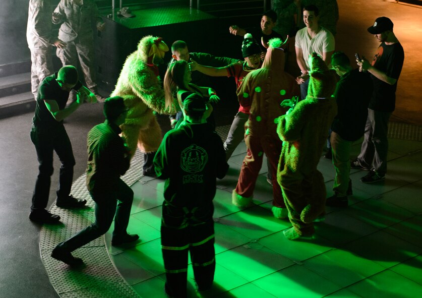 Soldiers, Airmen and civilians dance to Electronic Dance Music at Ramstein Air Base, Germany, Jan. 31, 2015. The USO brought four Electronic Dance Music disc jockeys to Ramstein as part of their first overseas EDM tour. (U.S. Air Force photo/Senior Airman Armando A. Schwier-Morales)