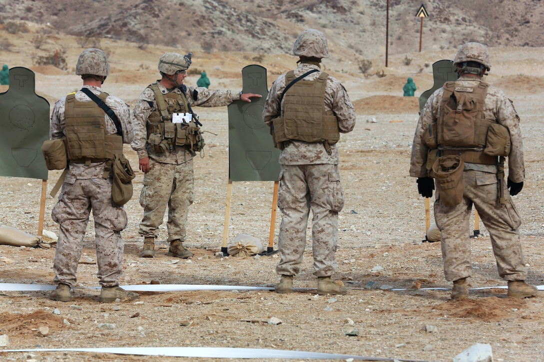 Marines review their shot groups after shooting at a rifle range during ...