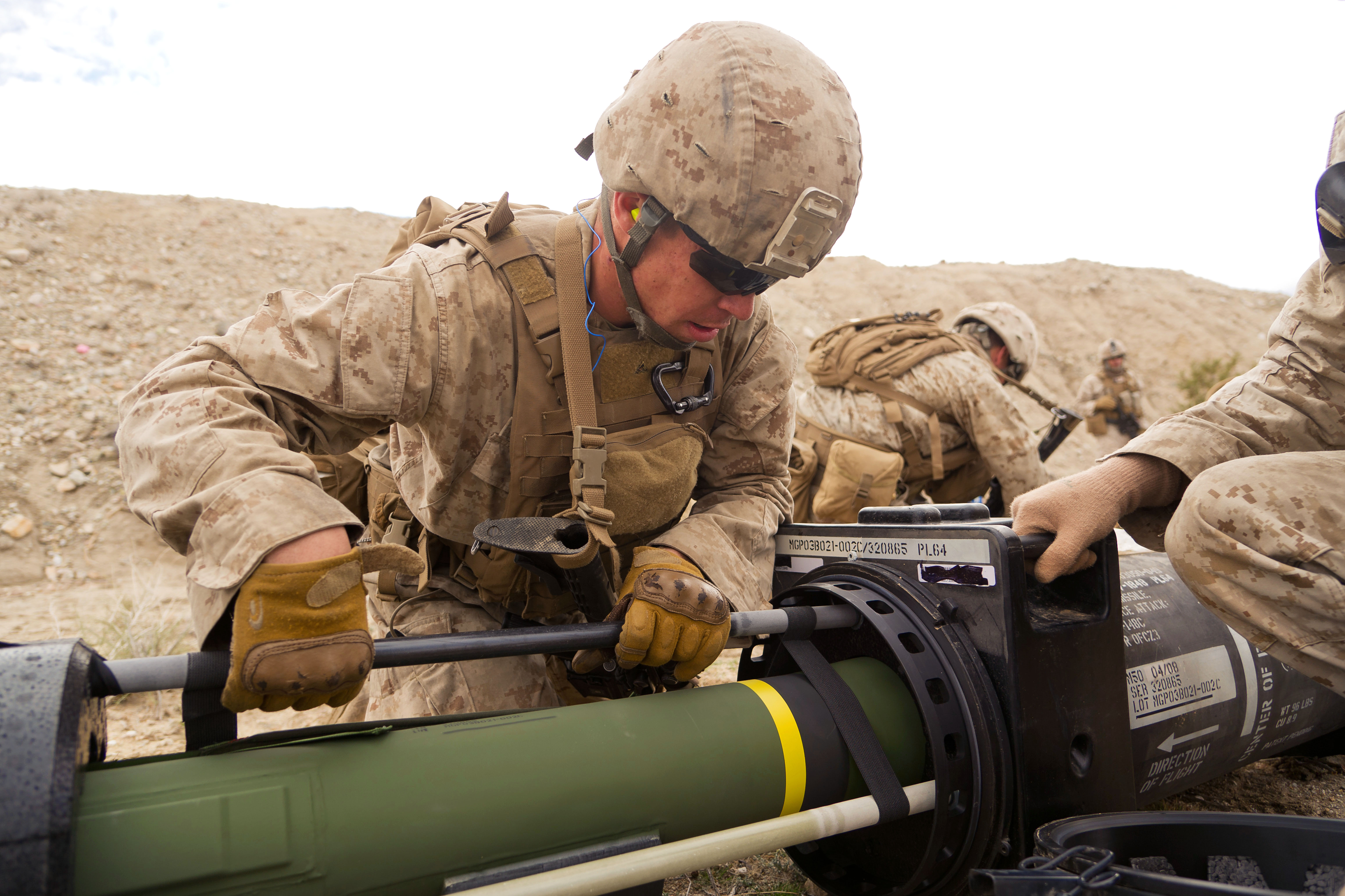 Marine Corps Lance Cpl. Zachary Lauritzen performs a pre-combat check ...