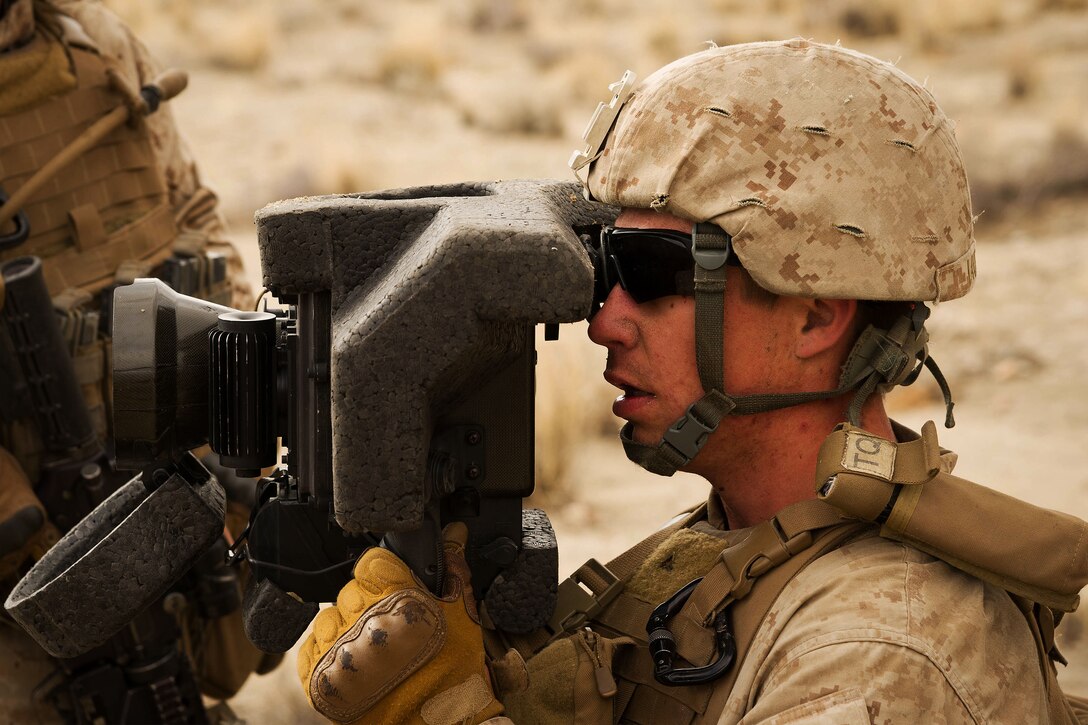 A Marine performs a pre-combat check on a Javelin shoulder-fired anti-tank missile guide while participating in an air assault course during Integrated Training Exercise 2-15 at the Marine Corps Air Ground Combat Center in Twentynine Palms, Calif., Jan. 31, 2015. The Marine Corps Air Ground Combat Center conducts relevant live-fire combined arms training, urban operations, and joint/coalition level integration training that promotes operational forces readiness. The Marines are assigned to the 1st Battalion, 4th Marines, Camp Pendleton, Calif. 