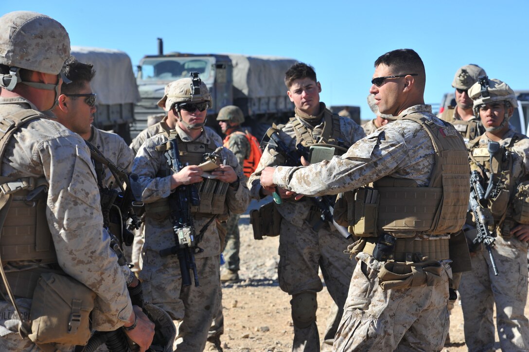 Marines are briefed following their participation in a platoon attack during Integrated Training Exercise 2-15 at the Marine Corps Air Ground Combat Center in Twentynine Palms, Calif., Jan. 25, 2015. 