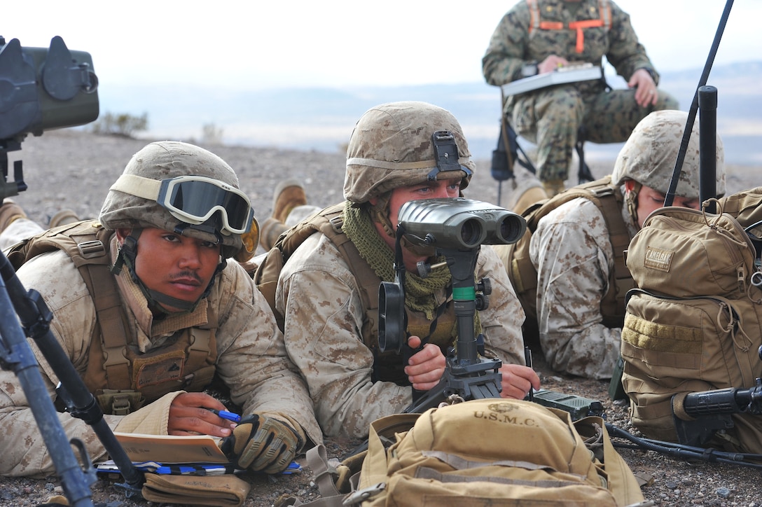 Members of a fire support team prepare to direct artillery fire while participating in a training event during Integrated Training Exercise 2-15 at the Marine Corps Air Ground Combat Center in Twentynine Palms. Calif., Jan. 27, 2015. 