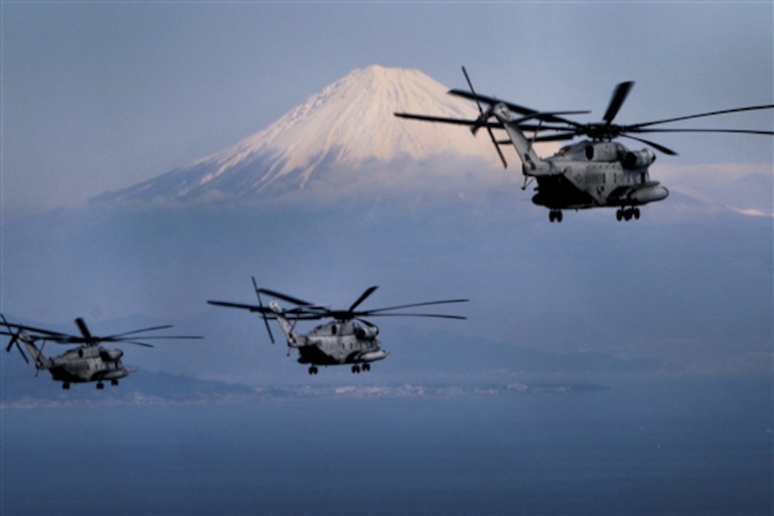 Three CH-53E Super Stallion helicopters fly past Mount Fuji, Japan, Jan. 24, 2015, during a two-day flight to Misawa Air Base, Japan, from Okinawa to support Exercise Forest Light 15-2. The semiannual exercise strengthens U.S. and Japan military relations. The CH-53E helicopters operate with Marine Heavy Helicopter Squadron 465, Marine Aircraft Group 16, currently assigned to 1st Marine Aircraft Wing, 3rd Marine Expeditionary Force.