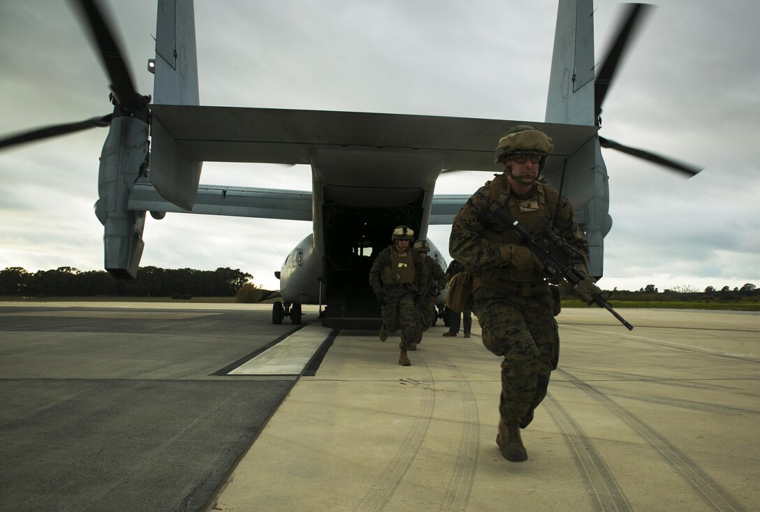Second Lt. Alan Poe, a platoon commander with Special-Purpose Marine Air-Ground Task Force Crisis Response – Africa, exits an MV-22 Osprey during an alert-force drill at Rota Air Base, Spain, Jan. 29, 2015. The Marines secured their landing zone, extracted a simulated casualty, and reloaded their aircraft in less than 30 minutes. (U.S. Marine Corps photo by Sgt. Paul Peterson/Released)