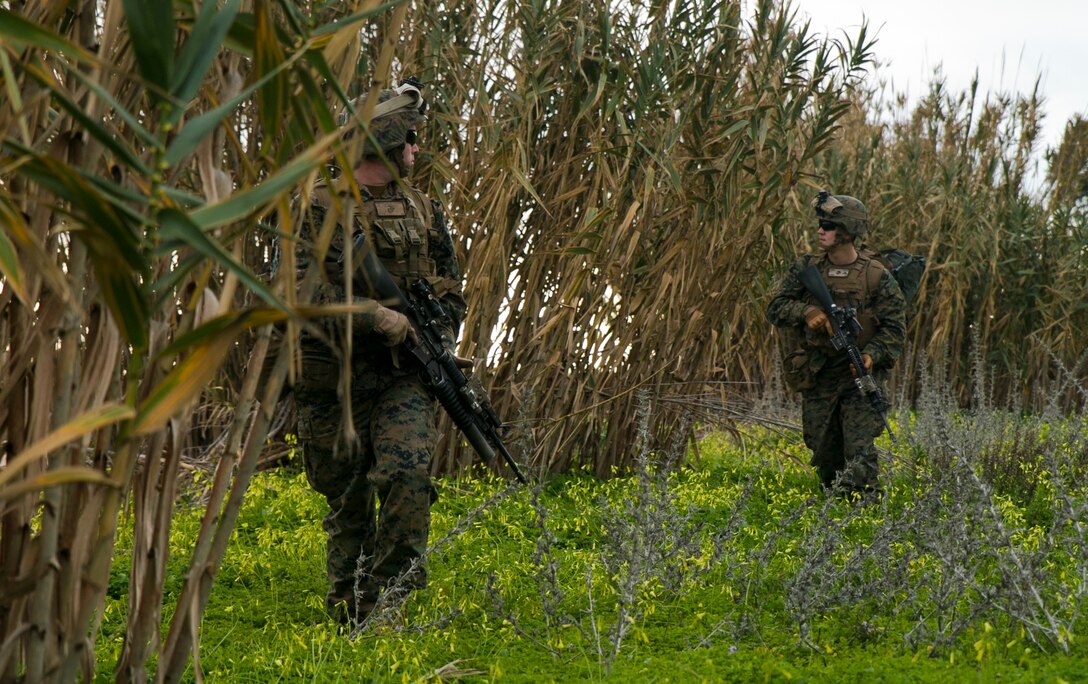 Two Marines with Special-Purpose Marine Air-Ground Task Force Crisis Response – Africa clear a path to a simulated casualty during an alert-force drill at Rota Air Base, Spain, Jan. 29, 2015. The unit launched a platoon of Marines shortly after receiving an unscripted casualty evacuation mission and spent less than 30 minutes on the ground retrieving the casualty. (U.S. Marine Corps photo by Sgt. Paul Peterson/Released)