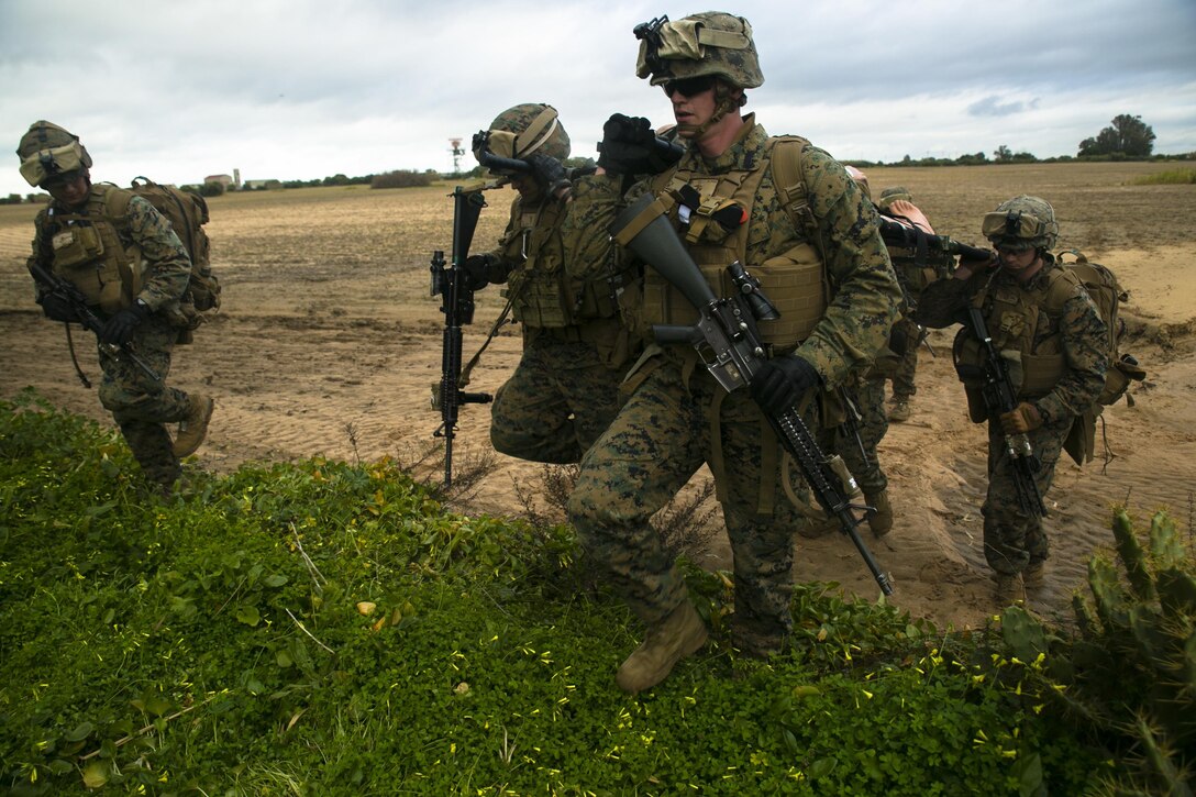 Marines with Special-Purpose Marine Air-Ground Task Force Crisis Response – Africa carry a simulated casualty during an alert-force drill at Rota Air Base, Spain, Jan. 29, 2015. The Marines used a collapsible stretcher to retrieve the casualty from a nearby field and return to their aircraft. (U.S. Marine Corps photo by Sgt. Paul Peterson/Released)