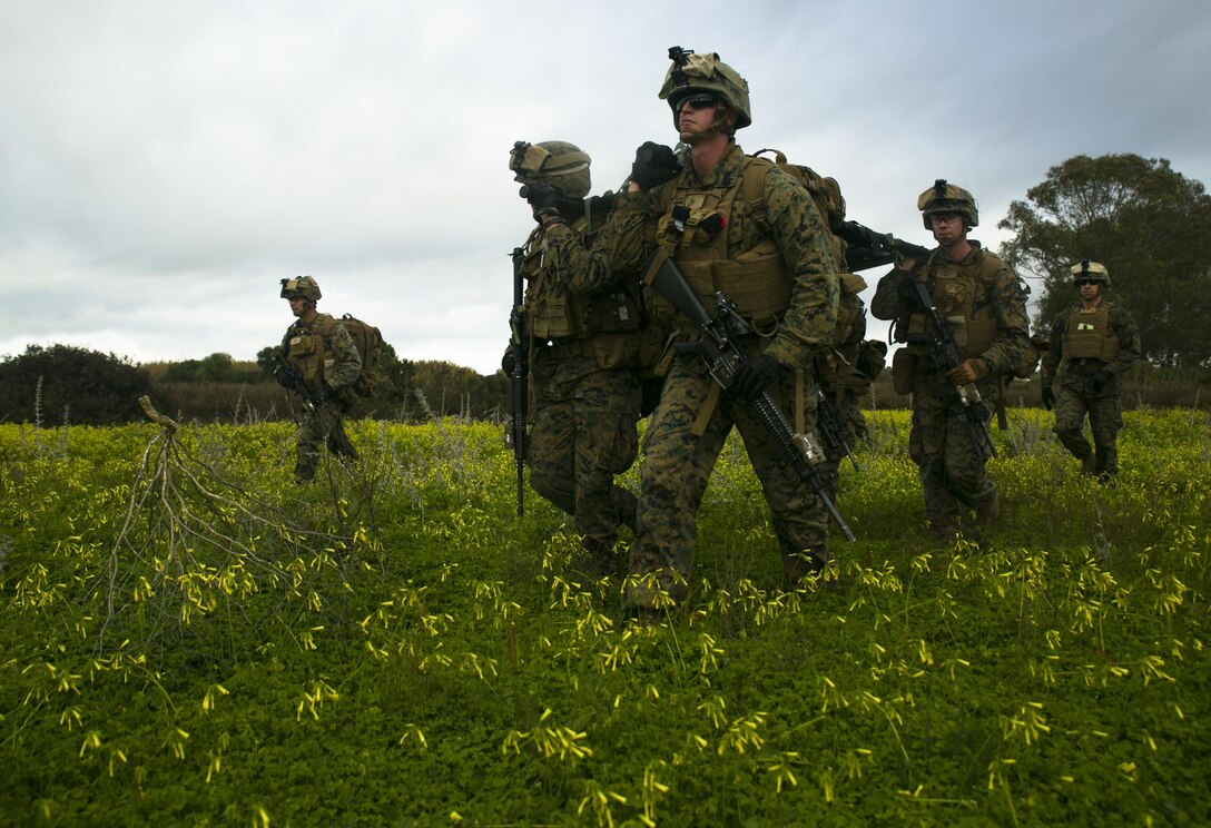 Marines with Special-Purpose Marine Air-Ground Task Force Crisis Response – Africa carry a simulated casualty during an alert-force drill at Rota Air Base, Spain, Jan. 29, 2015. The Marines used a collapsible stretcher to retrieve the casualty from a nearby field and return to their aircraft. (U.S. Marine Corps photo by Sgt. Paul Peterson/Released)
