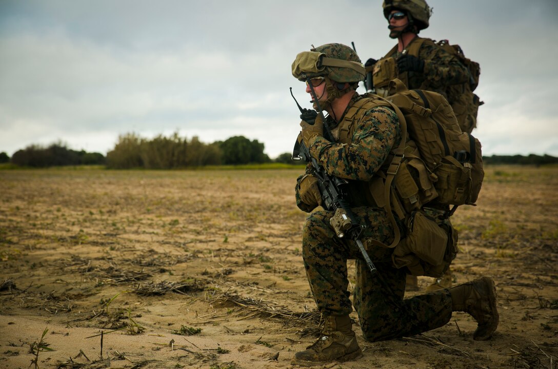 Second Lt. Alan Poe, a platoon commander with Special-Purpose Marine Air-Ground Task Force Crisis Response – Africa, uses a radio to communicate with his Marines at the site of a simulated casualty at Rota Air Base, Spain, Jan. 29, 2015. Poe helped coordinate the unit’s response to an unscripted casualty evacuation scenario designed to test the flexibility of SPMAFT-CR-AF’s alert force. (U.S. Marine Corps photo by Sgt. Paul Peterson/Released)