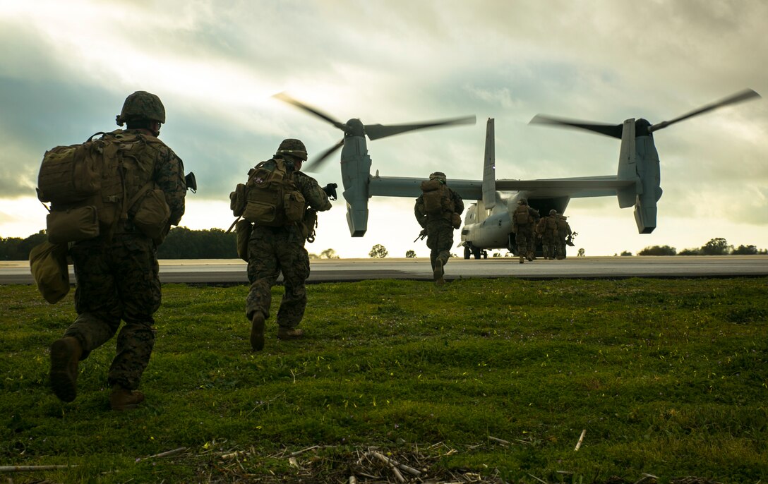 Marines with Special-Purpose Marine Air-Ground Task Force Crisis Response – Africa run aboard an MV-22 Osprey during an alert-force drill at Rota Air Base, Spain, Jan. 29, 2015. A platoon of Marines successfully carried out a simulated casualty evacuation mission launched from their staging area at Morón Air Base, Spain, where SPMAGTF-CR-AF is postured to respond to regional crises. (U.S. Marine Corps photo by Sgt. Paul Peterson/Released)