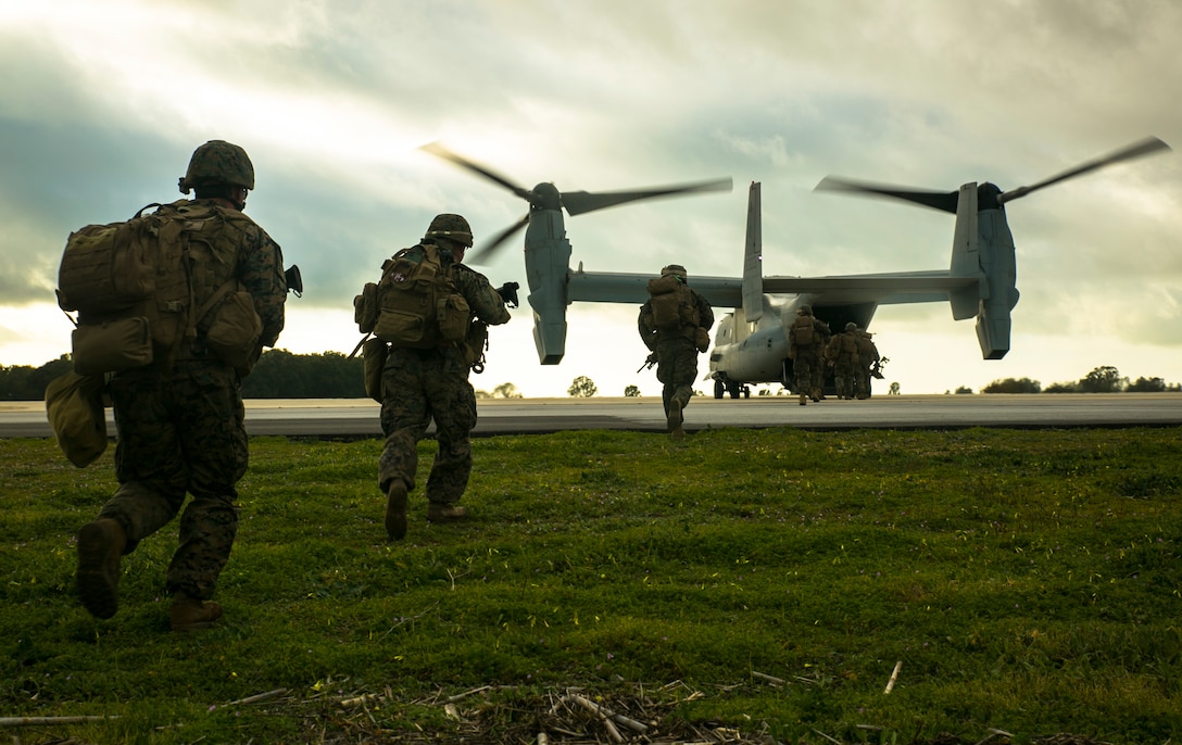 Marines with Special-Purpose Marine Air-Ground Task Force Crisis Response – Africa run aboard an MV-22 Osprey during an alert-force drill at Rota Air Base, Spain, Jan. 29, 2015. A platoon of Marines successfully carried out a simulated casualty evacuation mission launched from their staging area at Morón Air Base, Spain, where SPMAGTF-CR-AF is postured to respond to regional crises. (U.S. Marine Corps photo by Sgt. Paul Peterson/Released)