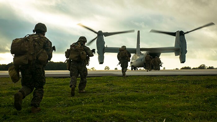 Marines with Special-Purpose Marine Air-Ground Task Force Crisis Response – Africa run aboard an MV-22 Osprey during an alert-force drill at Rota Air Base, Spain, Jan. 29, 2015. A platoon of Marines successfully carried out a simulated casualty evacuation mission launched from their staging area at Morón Air Base, Spain, where SPMAGTF-CR-AF is postured to respond to regional crises. (U.S. Marine Corps photo by Sgt. Paul Peterson/Released)