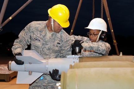 Senior Airman James Hampton and Airman 1st Class Porshia Montgomery work to install the tail fin assembly on a GBU-38 JDAM bomb at Davis-Monthan Air Force Base, Ariz., Jan. 27, 2015. Airmen of the Michigan Air National Guard’s 127th Wing are participating in a two-week long exercise known as Snowbird at the Total Force Training Center at Davis-Monthan Air Force Base, Arizona The bombs will be loaded on A-10 Thunderbolt II aircraft flown by the 107th Fighter Squadron during the exercise.