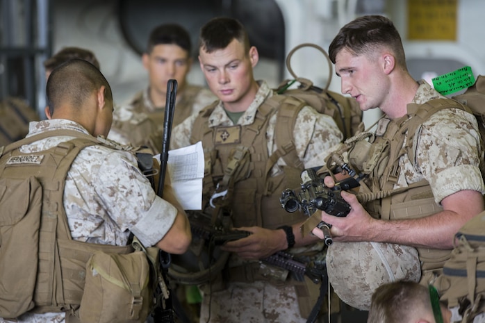 U.S. Marines with Echo Company, 2nd Marines 6th Regiment, perform a weapons check on the USS Kearsarge (LHD-3) during exercise Bold Alligator 14, off the eastern coast of the United States, Nov. 1, 2014. Exercise Bold Alligator 14 is a multi-national, synthetic naval amphibious exercise designed to train across the full range of amphibious capabilities in order to provide unique and contemporary solutions to global challenges.