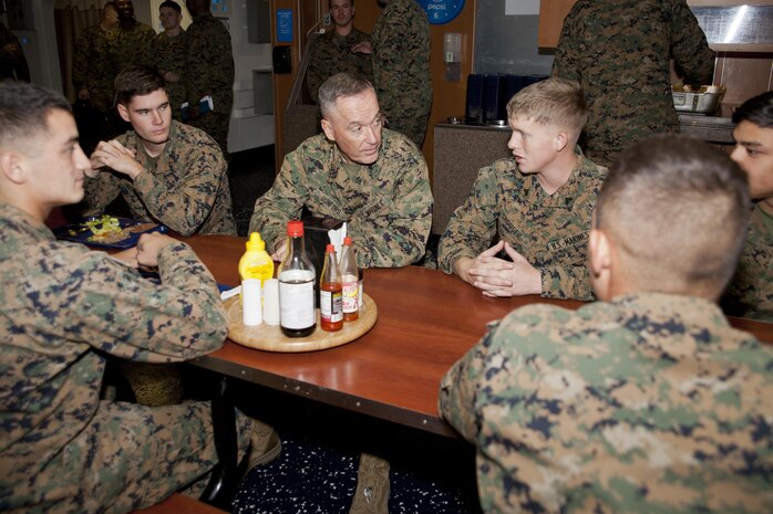 Commandant of the Marine Corps Gen. Joseph F. Dunford Jr., center, interacts with Marines during the 2014 Bold Alligator exercise aboard USS Kearsarge (LHD 3) in the Atlantic Ocean, Nov. 4, 2014. Bold Alligator is an annual exercise in which Marines and Sailors conduct missions from the sea with other services and international partners.