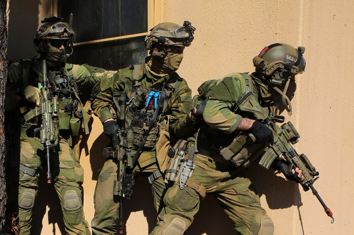Soldiers with the Norwegian Telemark Battalion prepare to raid an urban facility during the annual multinational exercise Bold Alligator, Nov. 7, 2014, on Marine Corps Base Camp Lejeune. Norwegian, British, Dutch and Canadian troops engaged in street-to-street, house-to-house simulated combat against enemy forces roleplayed by U.S. Marines. Bold Alligator is a scenario-driven, simulation-supported, amphibious assault exercise and is the largest exercise held on the East Coast.