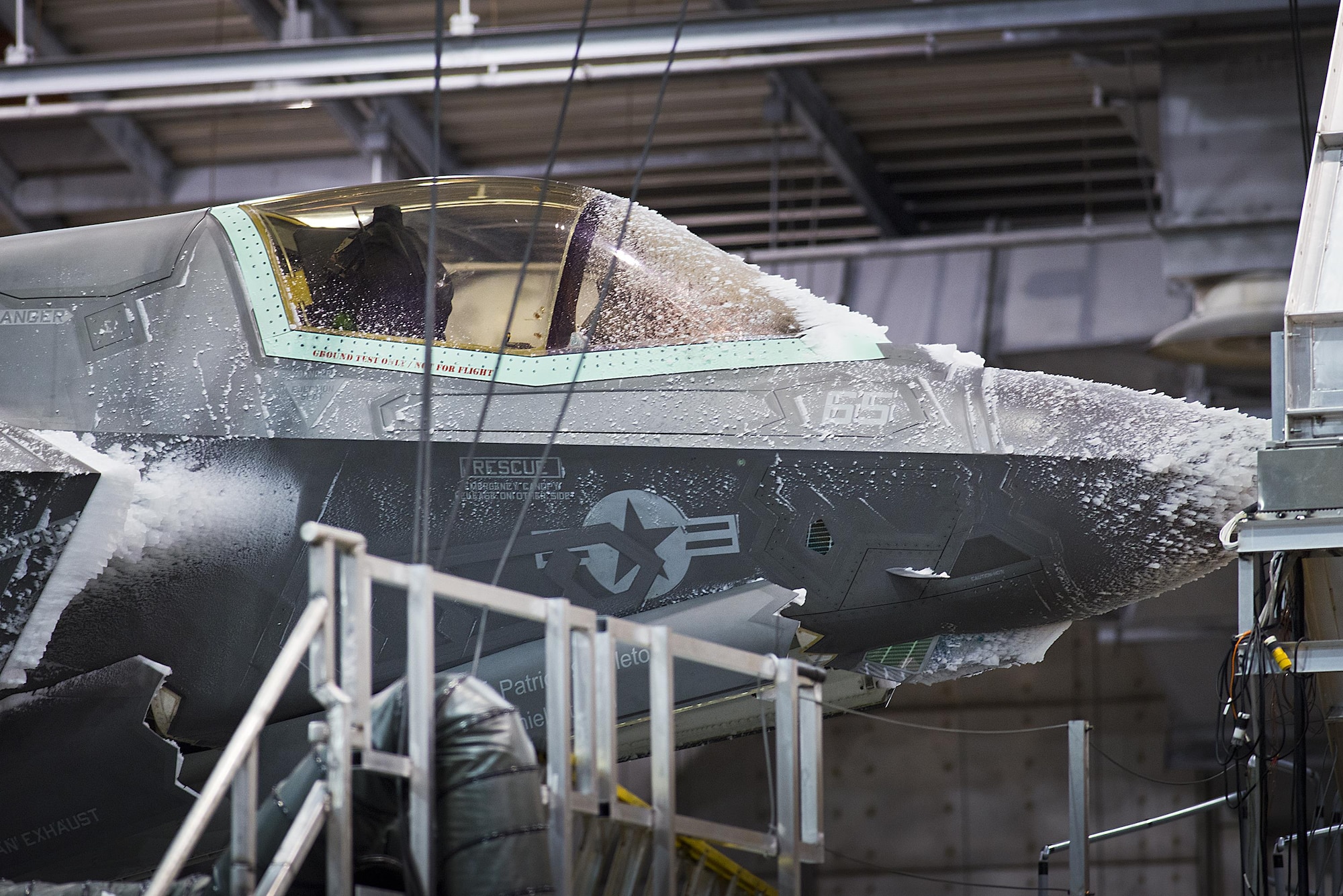 An F-35 Lightning II endures freezing temperatures in the 96th Test Wing's McKinley Climatic Laboratory Jan. 27, 2015, at Eglin Air Force Base, Fla. The joint strike fighter has undergone four months of climate testing in the lab to certify the fleet to deploy to any corner of the world. (U.S. Air Force photo/Samuel King Jr.)