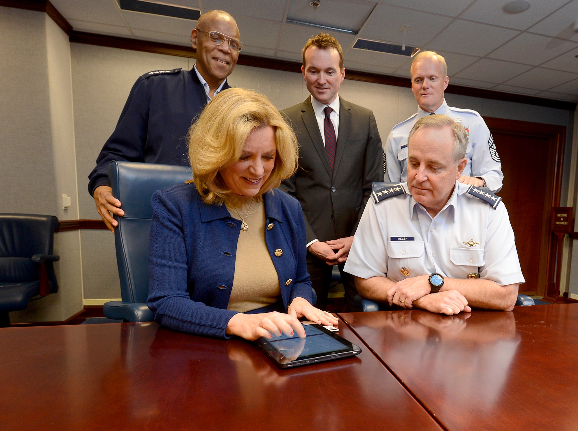 Air Force senior leaders review Air Force Assistance Fund affiliate websites while in the Pentagon, during preparation for the 2015 Air Force Assistance Fund Campaign. Seated are Secretary of the Air Force Deborah Lee James and Air Force Chief of Staff Gen. Mark A. Welsh III. Standing from the left to right are Air Force Vice Chief of Staff Gen. Larry O. Spencer, Under Secretary of the Air Force Eric Fanning and Chief Master Sgt. of the Air Force James A. Cody. (U.S. Air Force photo/Scott M. Ash)