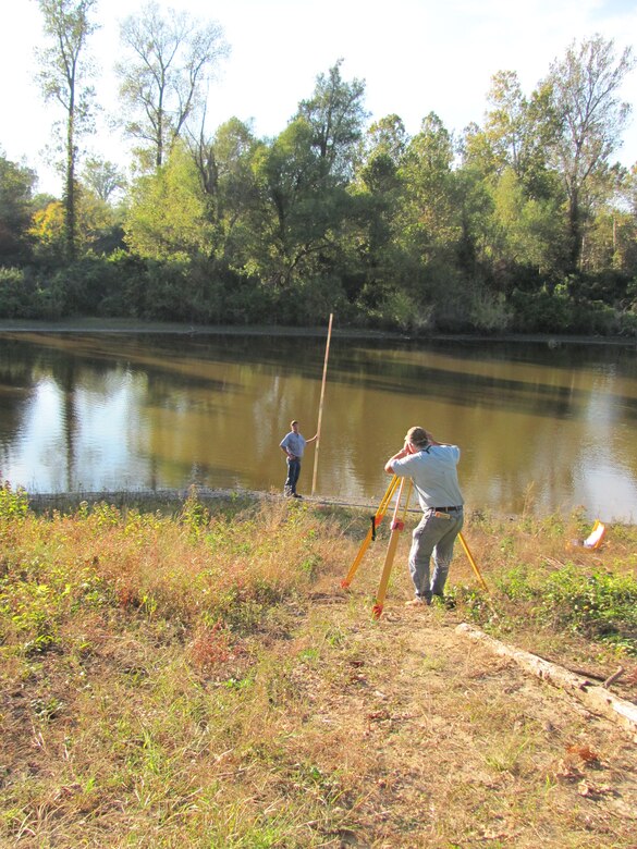 Researchers complete survey work for temporary gauge installations. 