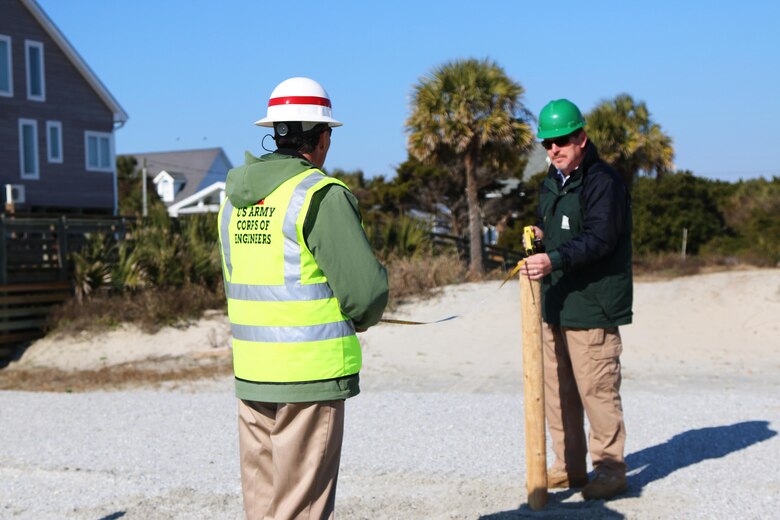 The Charleston District has begun the fencing and grassing project at Folly Beach to build dunes behind the recently completed renourishment project.