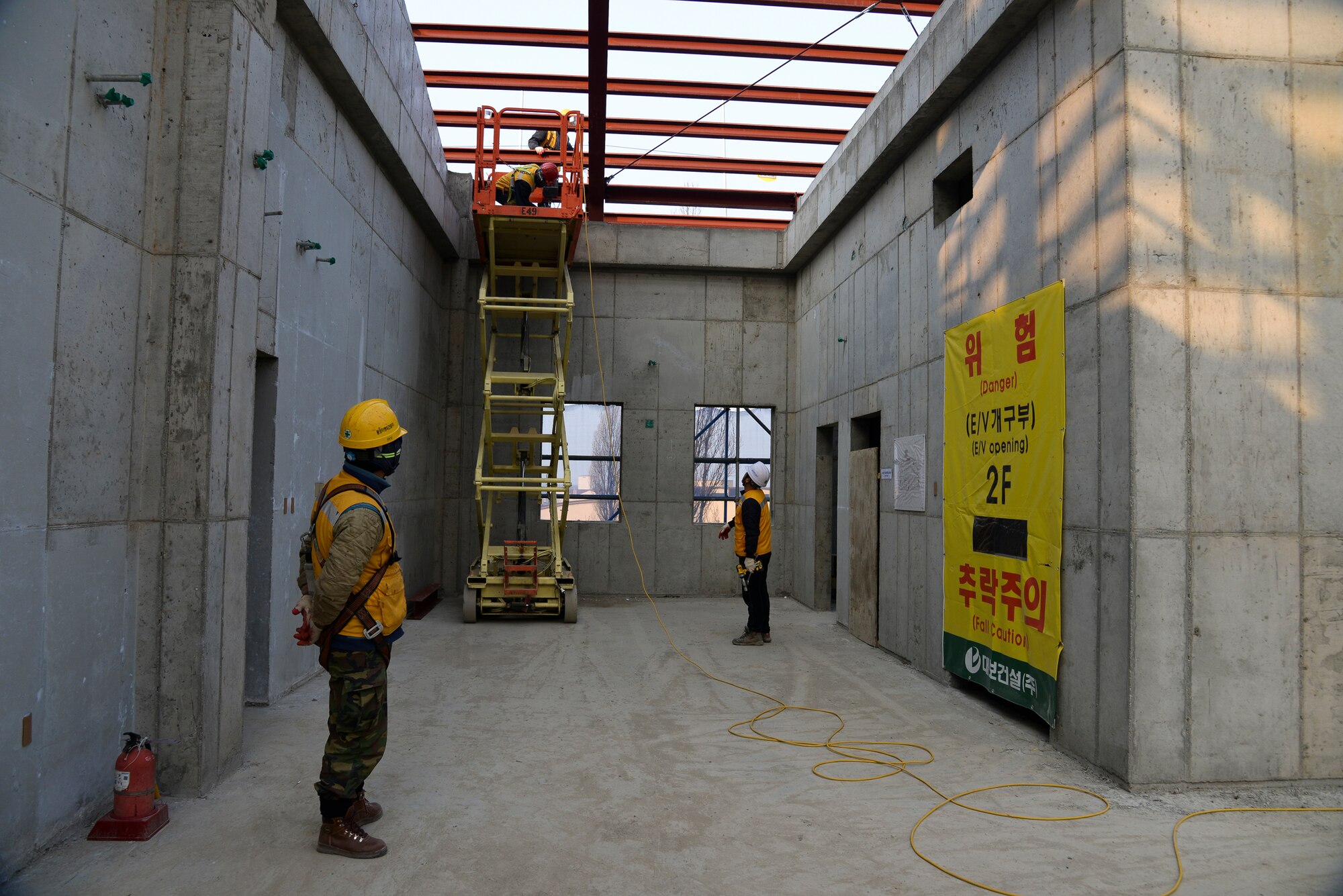 Contractors work on the inside of a building Feb. 4, 2015, at Osan Air Base, Republic of Korea. Osan AB is constantly adding new construction projects in order to enhance quality of life and stability of more than 10,000 residents on base.  (U.S. Air Force photo by Senior Airman Matthew Lancaster)