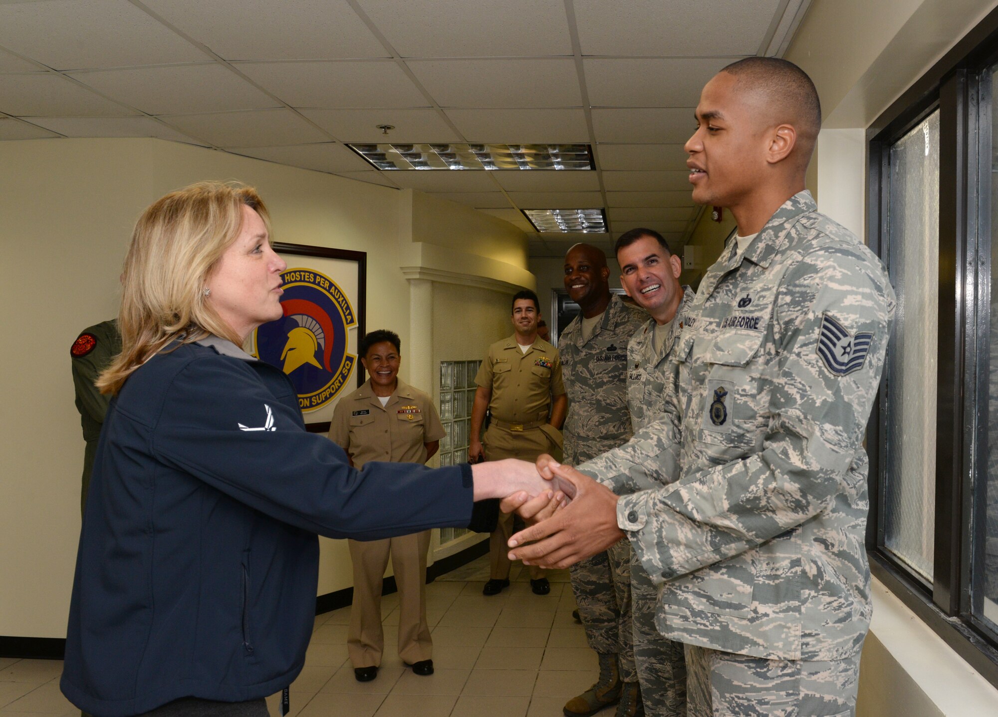 Secretary of the Air Force Deborah Lee James meets with Tech. Sgt. Oliver
Bradley, 36th Security Forces Squadron, who was recently promoted under the
Stripes for Exceptional Performers Program as well as highlighted for his
participation in the U.S. Air Force Basketball team Feb. 3, 2015, at
Andersen Air Force Base, Guam. James spent several hours at Andersen as part
of a re-fueling stop while returning to Washington DC after a region visit
which included stops in Antarctica and New
Zealand supporting Operation Deep Freeze.
