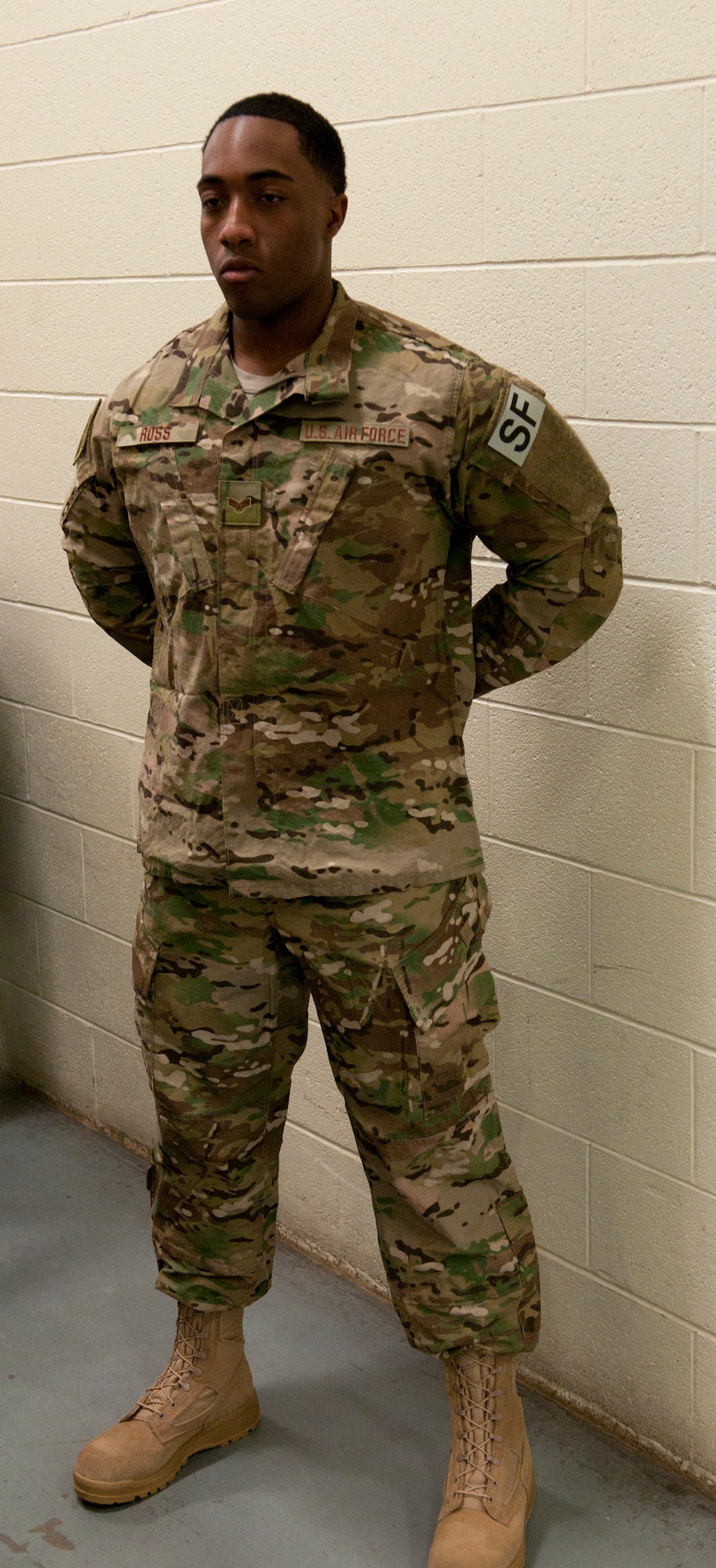 Senior Airman Demetris Ross, 790th Missile Security Forces Squadron Security Support Team, models the new Operation Enduring Freedom Camouflage Pattern uniform Feb. 2, 2015, in the Peacekeeper High Bay on F.E. Warren Air Force Base, Wyo. Defenders across the 20th Air Force who travel out and protect the missile fields will receive the new uniforms as part of the Air Force Global Strike Command Model Defender Program. (U.S. Air Force photo by Airman 1st Class Brandon Valle)
