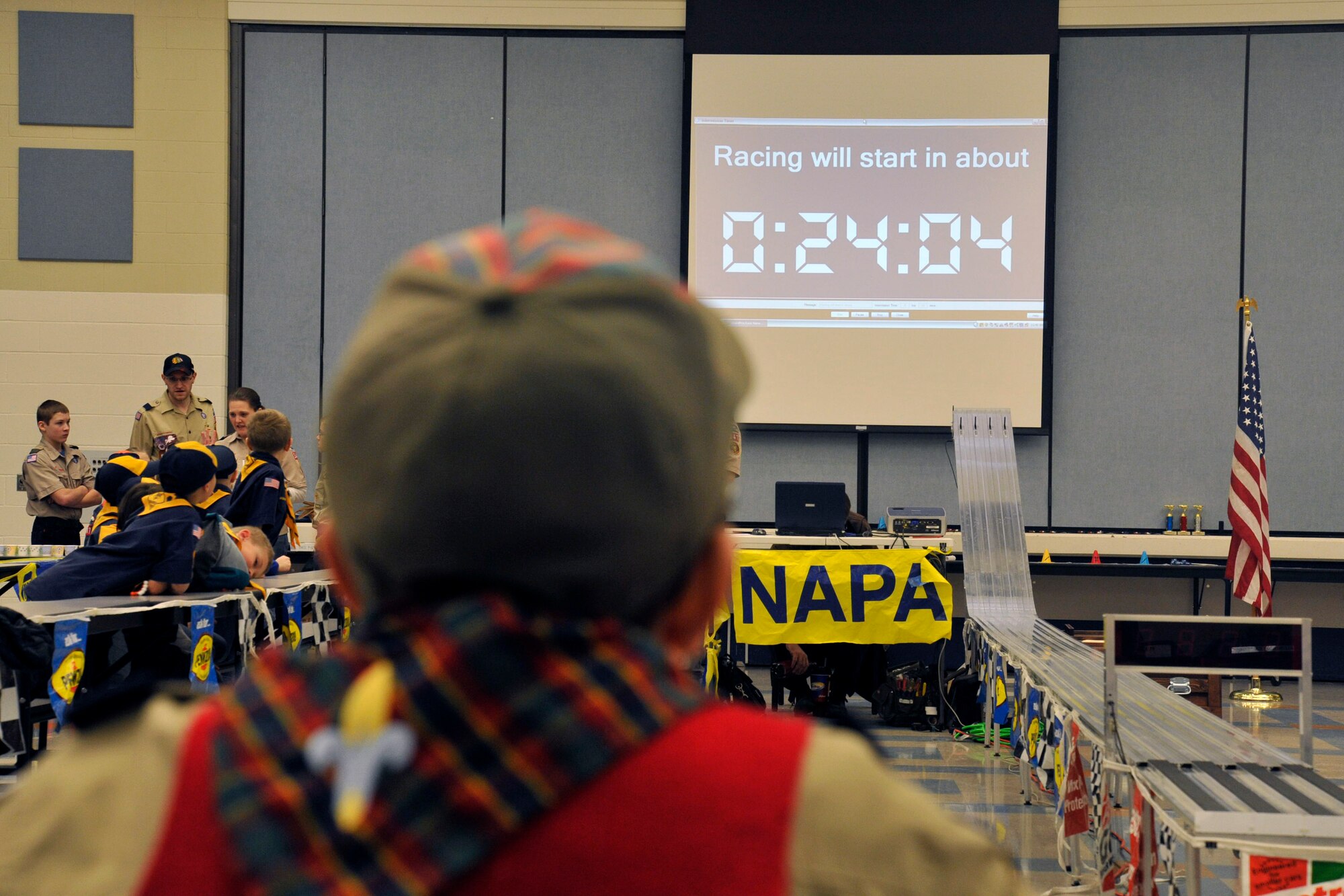 Scouts wait for the Pinewood Derby to begin Jan. 31, 2015, at Fairchild Air Force Base, Wash. The Pinewood Derby is held annually and is a chance for the Cub Scouts to prove who has built the fastest derby car in their pack. (U.S. Air Force photo/Airman 1st Class Nicolo J. Daniello) 
