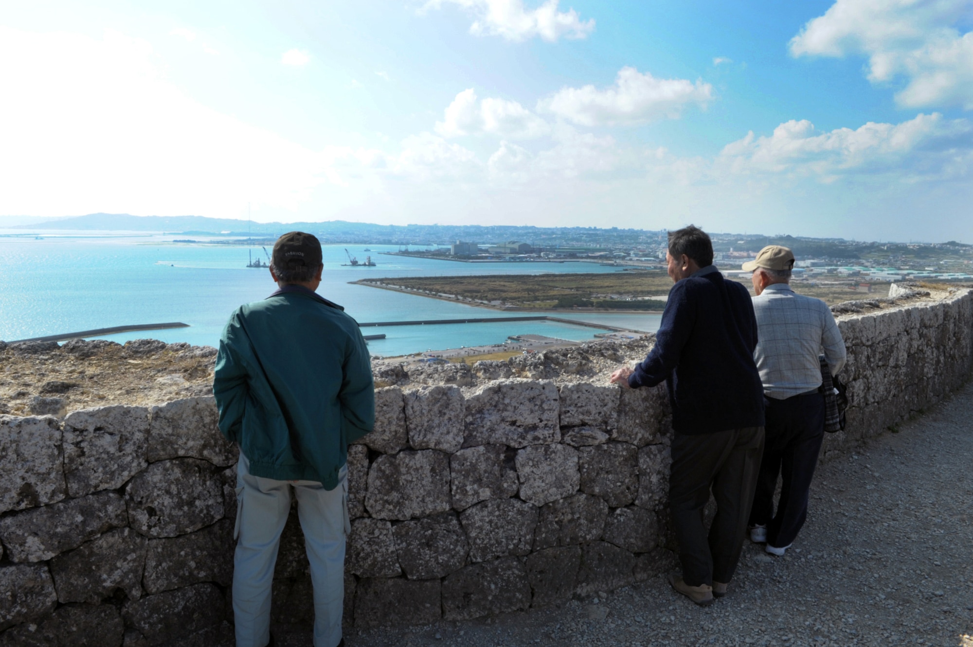 Visitors look out at the view from the top of the Katsuren Castle ruins on Okinawa, Japan, on Jan. 25, 2015.  The castle, which dates back to the 13th century, was added to the World Heritage List in 2000. (U.S. Air Force photo by Tim Flack)