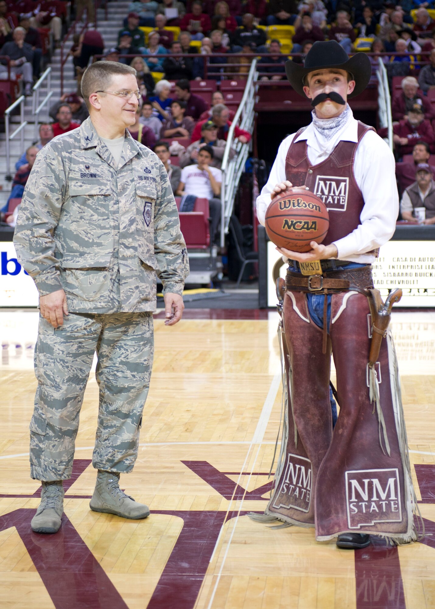 Col. Robert G. Brown made a special guest appearance for Military Appreciation Night at the New Mexico State University men’s basketball game Jan. 31, 2015 at the Pan American Center in Las Cruces, N.M. NMSU presented Brown with a signed basketball of all the Aggies men’s basketball team members. This presentation was to honor those that serve our country. (U.S. Air Force Staff Sgt. E’Lysia A. Wray/Released)