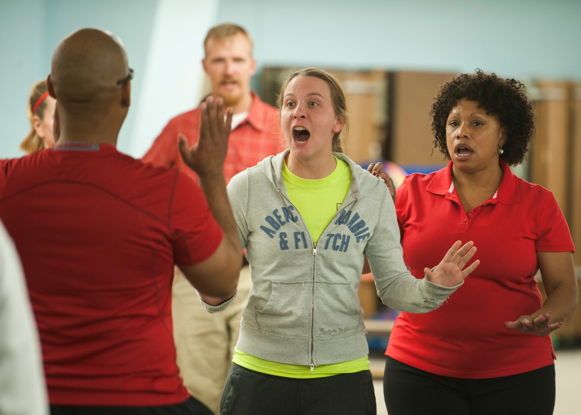 Staff Sgt. Amber Word, 49th Security Forces Squadron, yells at Tech. Sgt. Lawrence Standifer, 49th SFS, during Fear Adrenaline Stress Training at Holloman Elementary School Jan. 29, 2015. During FAST, male volunteers play “Bubba,” a threatening male. Participants learn self-defense moves to help protect them in a situation in which they feel uncomfortable or afraid. One important tactic learned during FAST is to use a powerful voice and a defensive stance to ward off unwanted attention. (U.S. Air Force photo by Airman 1st Class Emily A. Kenney/Released) 