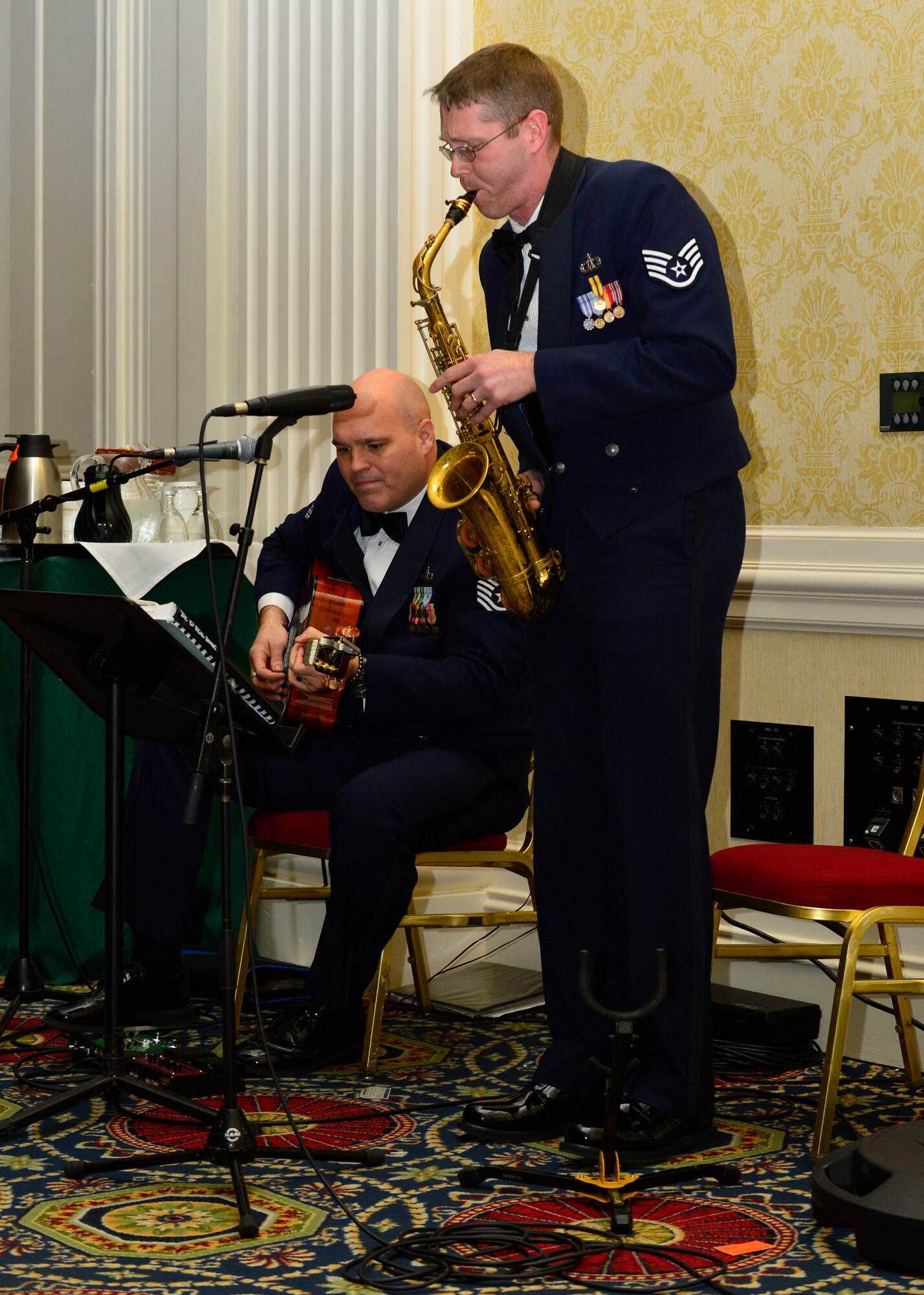 Staff Sgt. Brian Connolly and Tech. Sgt. Jason Cale provide musical entertainment during the 2014 Annual Awards Ceremony Jan 30, 2015, at the Rollins Center inside of Dover Downs, Dover, Del. Connolly and Cale are both members of the Air Force Band. (U.S. Air Force photo/Airman 1st Class William Johnson)