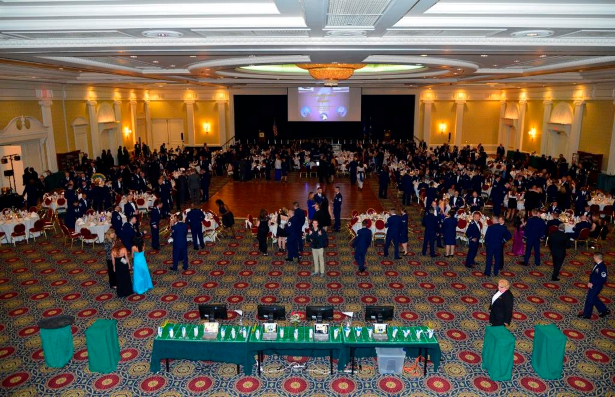 Team Dover members attend the 2014 Annual Awards Ceremony Jan. 30, 2015, at the Rollins Center inside of Dover Downs, Dover, Del. The theme for this year’s ceremony was “Championship of Airmen” and featured Brig. Gen. Thomas Sharpy, 18th Air Force vice commander, as the guest speaker. (U.S. Air Force photo/Airman 1st Class William Johnson)