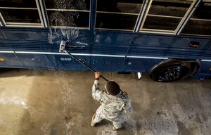 Airman 1st Class Jesse Brown, 628th Logistics Readiness Squadron vehicle operator, conducts a routine cleaning of a 44 passenger bus Jan. 28, 2015, at Joint Base Charleston, S.C. The buses are scheduled to be washed three times a month, unless additional cleaning is needed, by members of the LRS vehicle operations. The buses are used to transport individuals (Aircrews, tours, etc.) to and from the flight line. (U.S. Air Force Photo / Senior Airman Tom Brading )